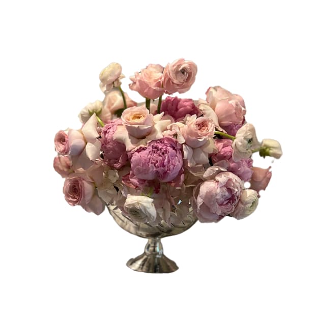 Pink Diamond - Indulge in the exquisite beauty of our handcrafted floral arrangement, a symphony of blush tones and delicate textures.  A curated collection of blush roses, spray roses, ranunculus, hydrangeas, and peonies are artfully arranged within a stunning designer glass vase, creating a timeless and elegant centerpiece.  This breathtaking bouquet is perfect for expressing heartfelt sentiments or adding a touch of refined luxury to any occasion.  *Peonies subject to seasonal availabilty, it will be substituted with an equal or better replacement if not available during fall and winter months*