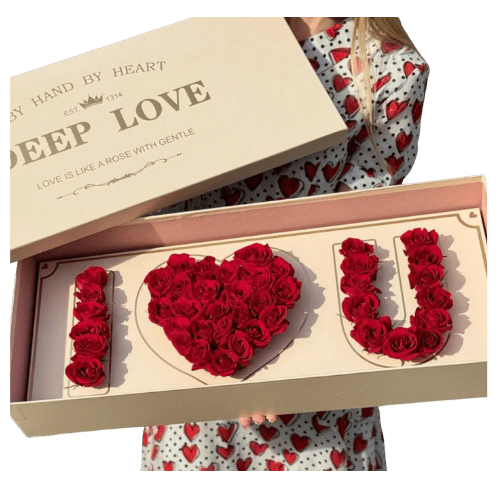 Rose Confession - Declare your love with &quot;Rose Confession,&quot; a breathtakingly romantic gift.  A beautiful pink box elegantly displays the words &quot;I LOVE YOU,&quot; meticulously crafted from vibrant red roses. This unforgettable expression of love is sure to leave a lasting impression.  *Please note box may vary by shade and is more of a soft pink color*