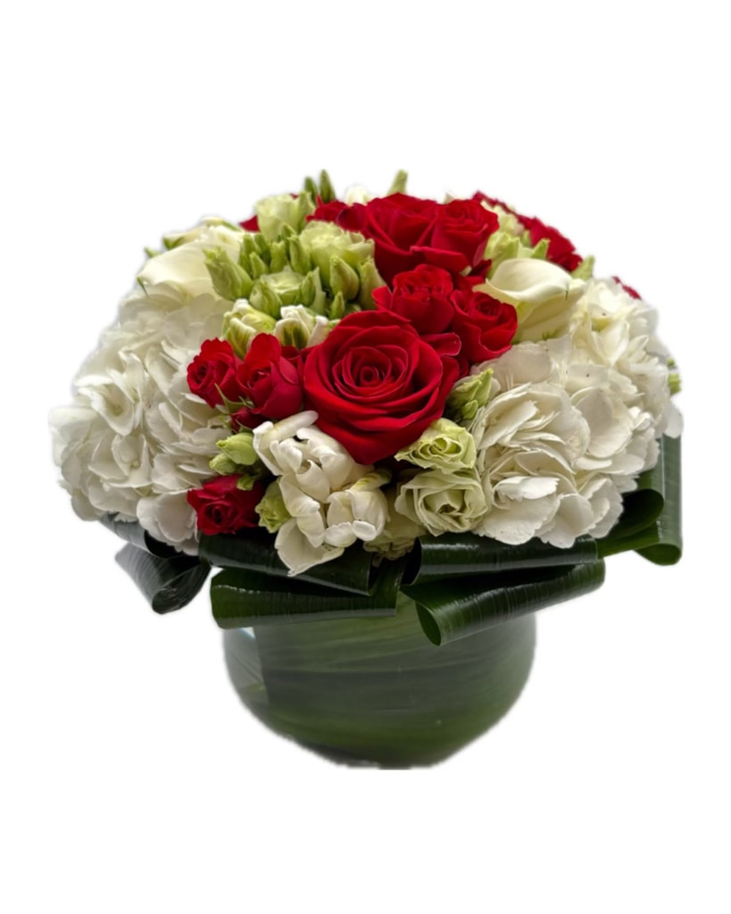Ruby Pearl Ruby Pearl - An elegant and timeless arrangement is perfect for any occasion. All white and red flowers to resemble a classic look. Top pick for holidays, romance, forgiveness, and thanks!