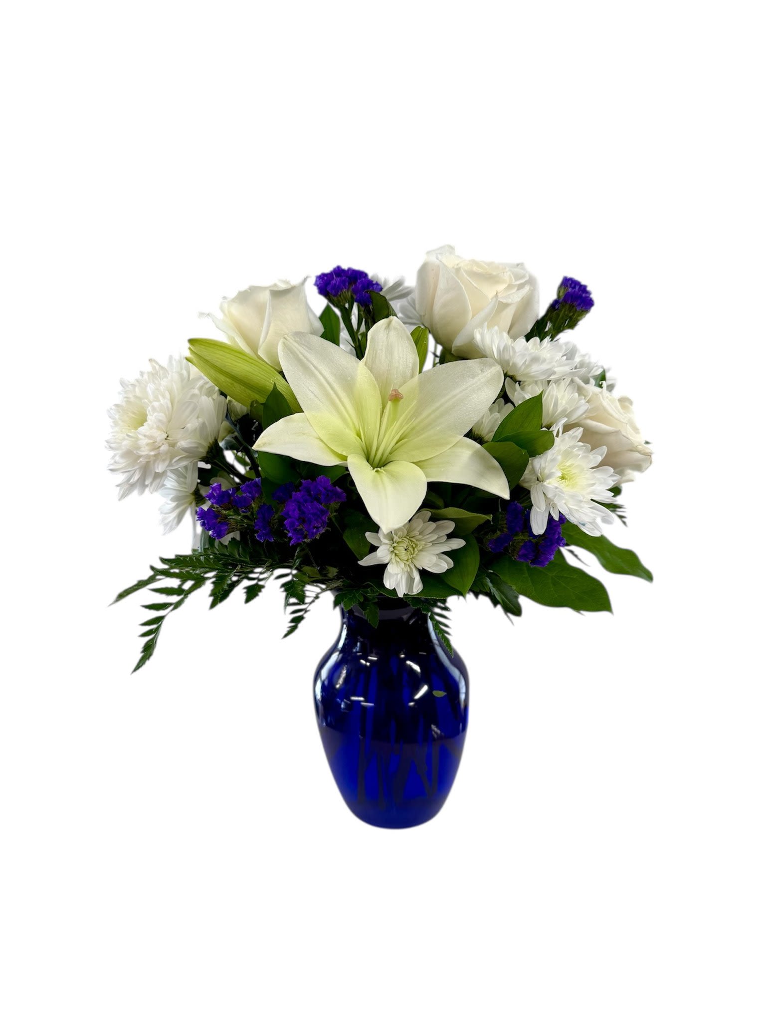 Wishes in Blue Wishes in Blue - Our Bouquet features lilies, roses, carnations and lush greens to captivate your recipient. A collection of brilliant white blooms is contrasted by a stunning and bold blue vase. This arrangement makes an excellent thank you, get well or engagement gift! For sharing your sympathies, this bouquet is best fit to send to a home or residence.