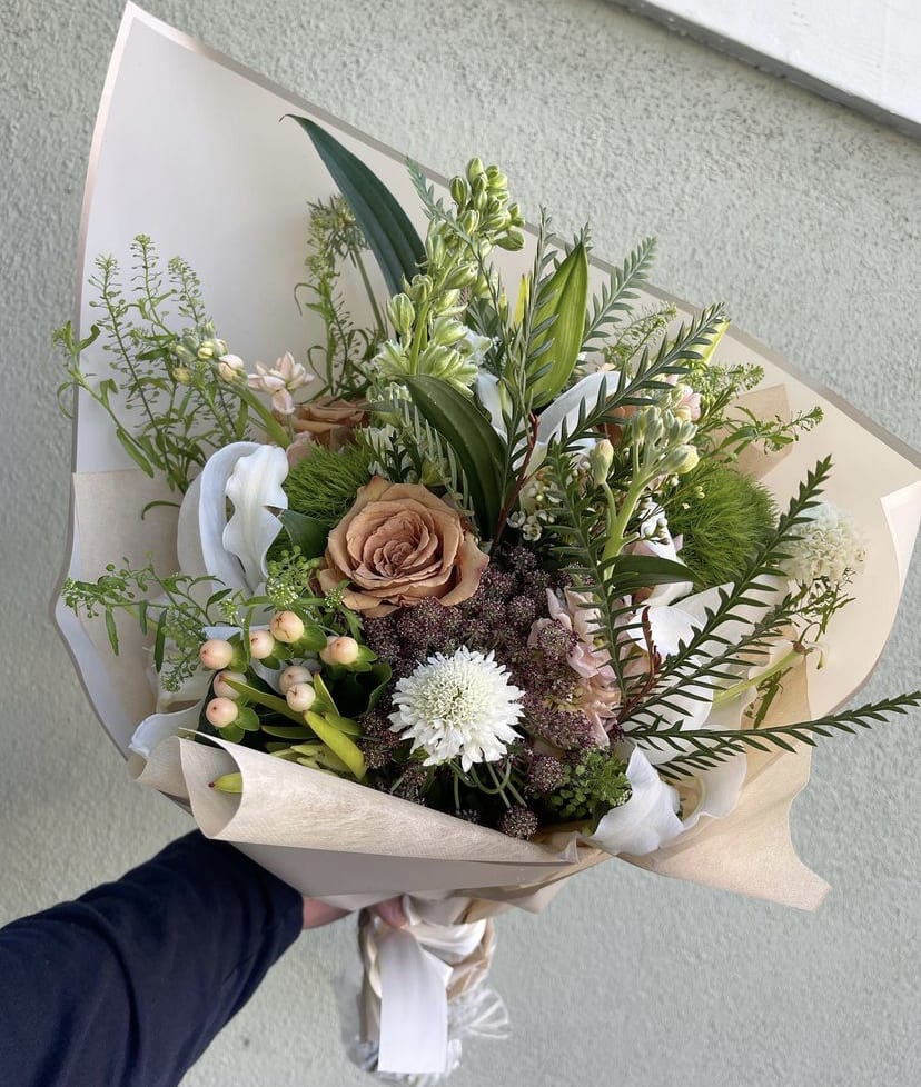 Soft Elegance - Mix flowers in a hand-tied bouquet.
