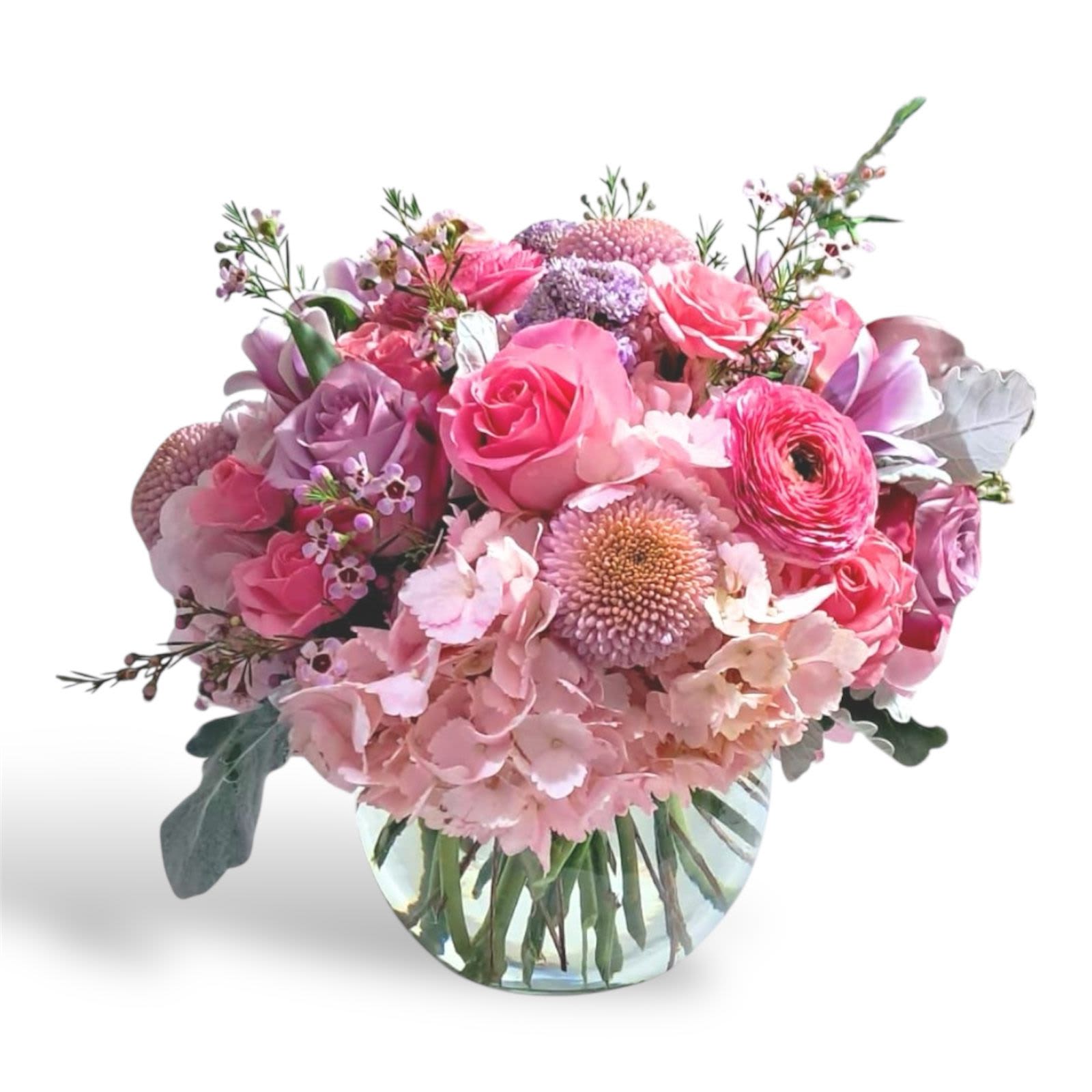 Floral Symphony Floral Symphony - This magical arrangement has roses, spray roses, cremons, hydrangeas, scabiosas, tulips, ranunculus, dusty miller leaves and wax flowers. The vase is a glass fish bowl.