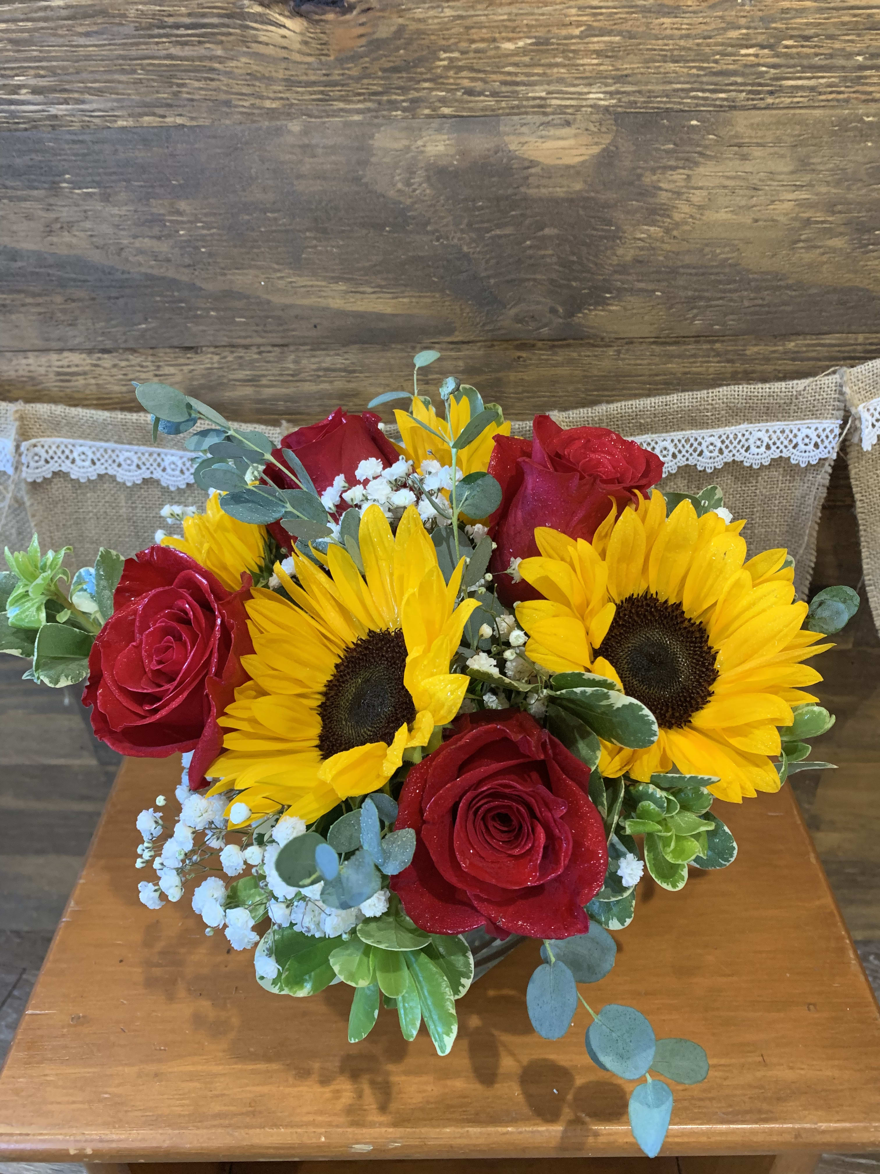 Sunflowers and Roses Forever - Sunflower and Roses accented by greens and babies breath will show how much you care.