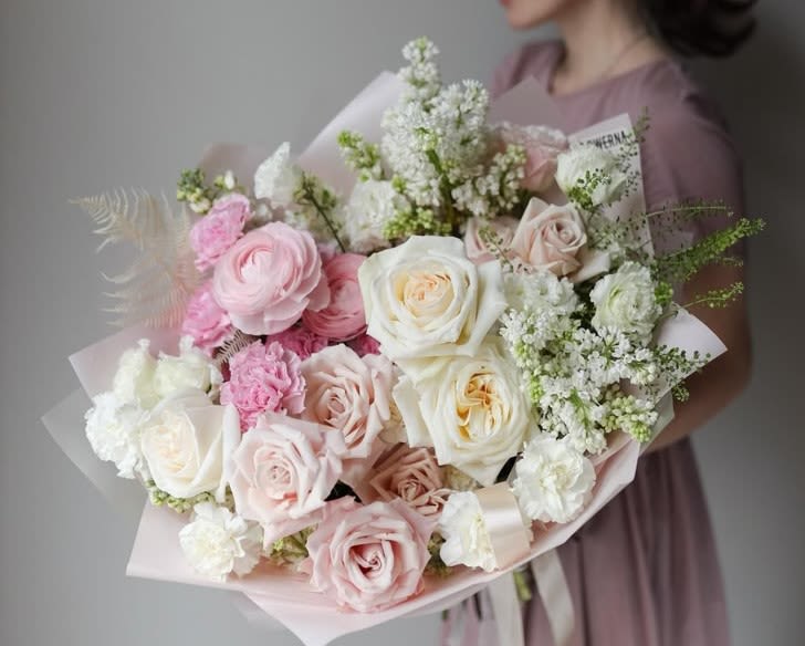 #38 Bellaria Bouquet - Light, joyful, and full of charm — the Bellaria bouquet captures the essence of a fresh breeze wrapped in blooms. A harmony of soft creams, blush pinks, and playful pops of coral and green, this bouquet feels like a breath of spring no matter the season.  Seasonal flowers can be replaced with a similar one. Wraps can also be replaced with others.