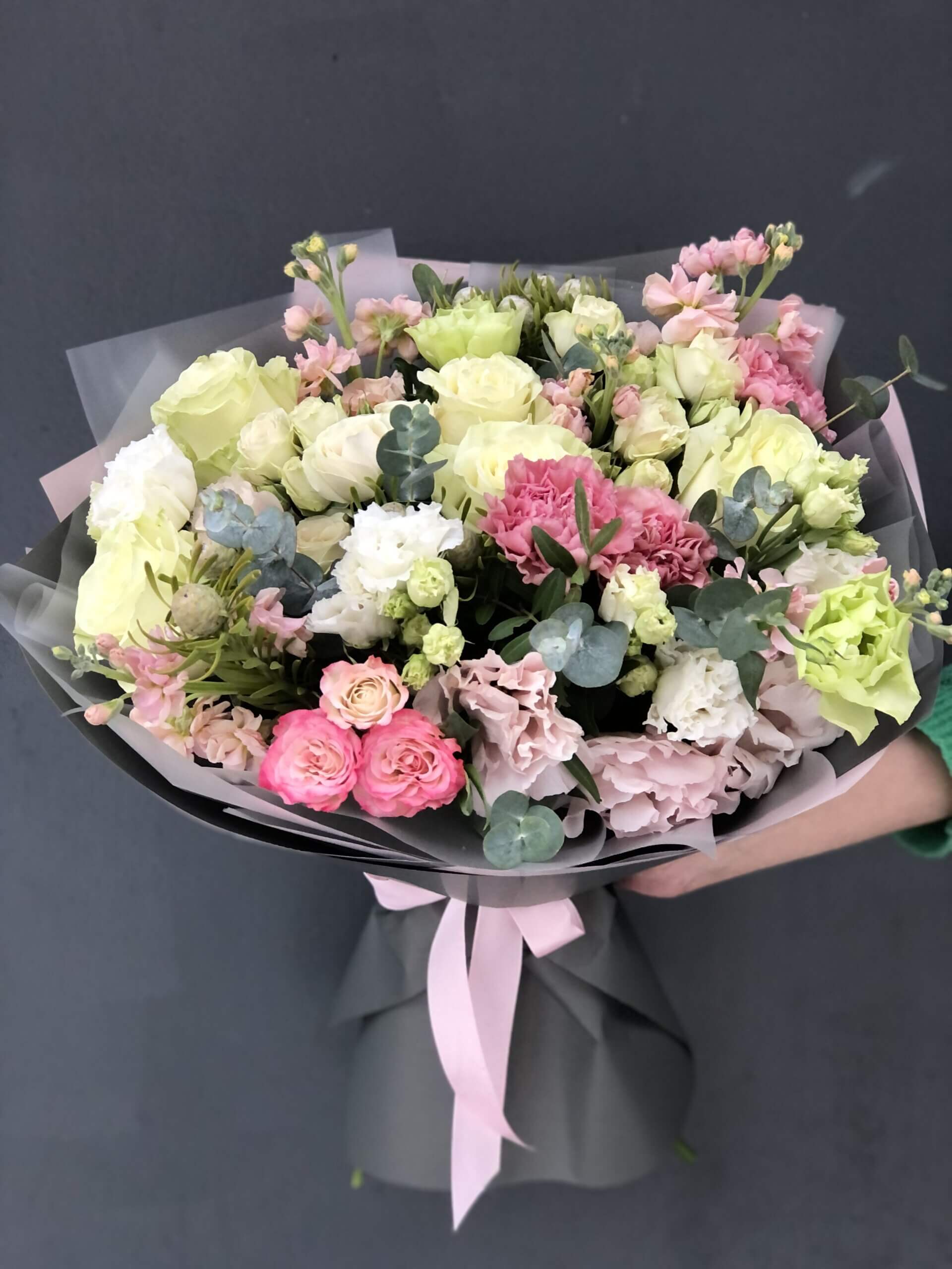#39 Maravelle Bouquet - Brimming with soft elegance and spirited color, the Maravelle bouquet is a joyful expression of charm and confidence. Featuring a delicate mix of pastel tones with vibrant touches, this bouquet radiates warmth, kindness, and effortless beauty.  Seasonal flowers can be replaced with a similar one. Wraps can also be replaced with others.