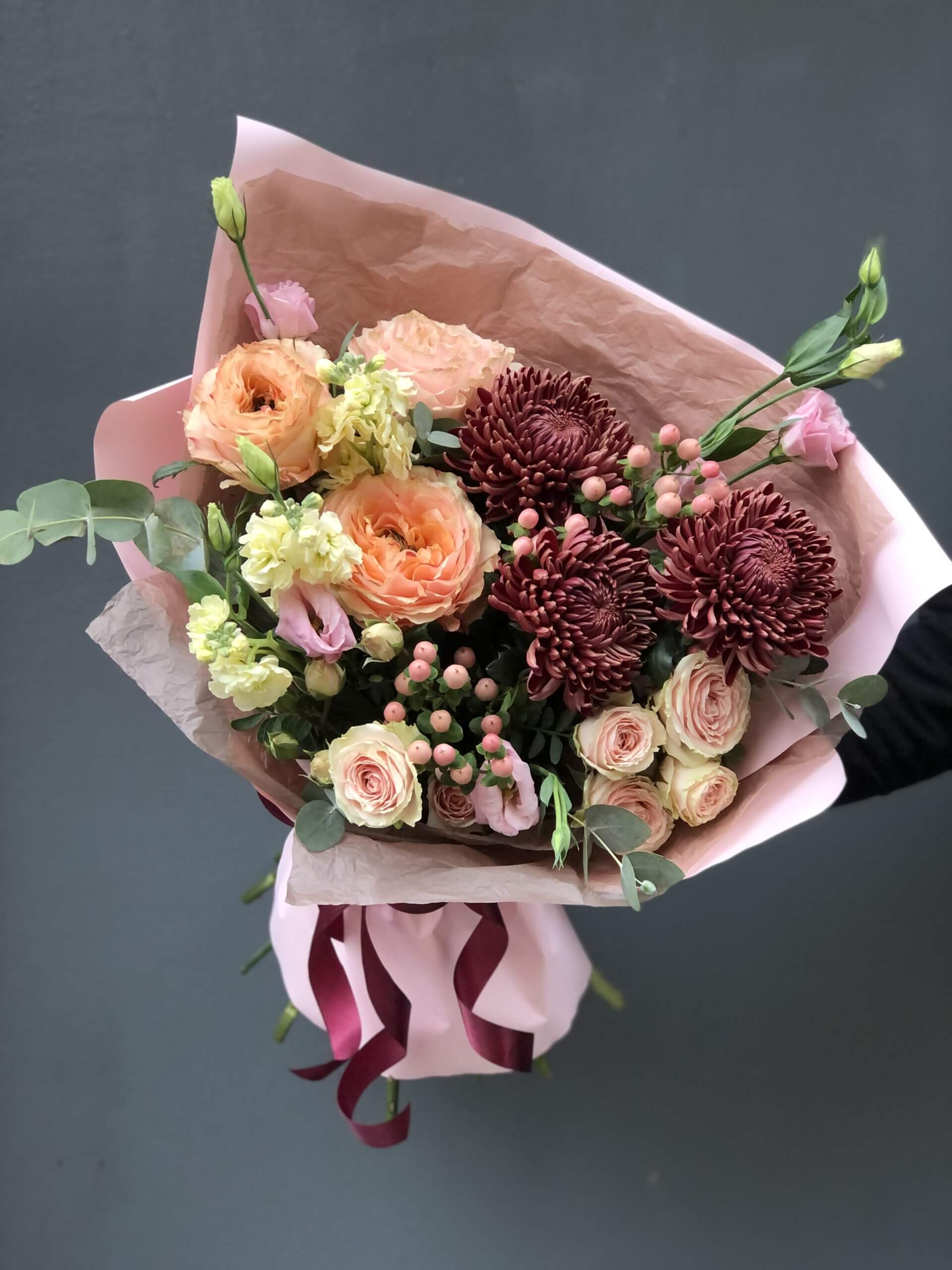 #36 Velvet Blush - A graceful blend of soft romance and bold elegance, the “Velvet Blush” bouquet is designed to leave a lasting impression. With a rich mix of blush, peach, cream, and deep wine tones, this hand-wrapped arrangement brings together contrast, texture, and harmony in every detail  Seasonal flowers can be replaced with a similar one. Wraps can also be replaced with others.