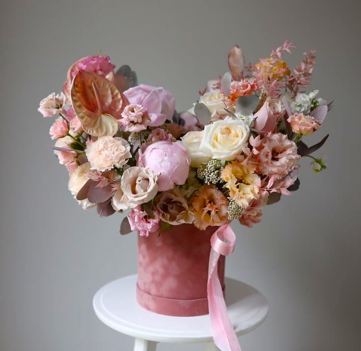 #47 Elenya Box - The Elenya box is where art and emotion meet in bloom. A flowing design of muted blushes, warm peaches, and creamy whites, this arrangement brings together texture, movement, and color in a way that feels modern yet timeless.  Seasonal flowers can be replaced with a similar one. Boxes and baskets can also be replaced with others.