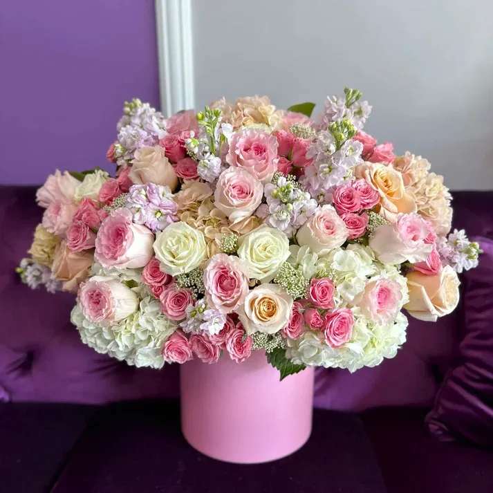 #17 Pink Vibe - A giant pink composition that will not leave anyone indifferent. This arrangement conveys all the deepest and most hidden feelings to a loved one. Each flower carries beauty and mystery  shown an actual size &quot;Deluxe&quot;  Seasonal or not available flowers can be replaced with a similar one. Boxes and baskets can also be replaced with others