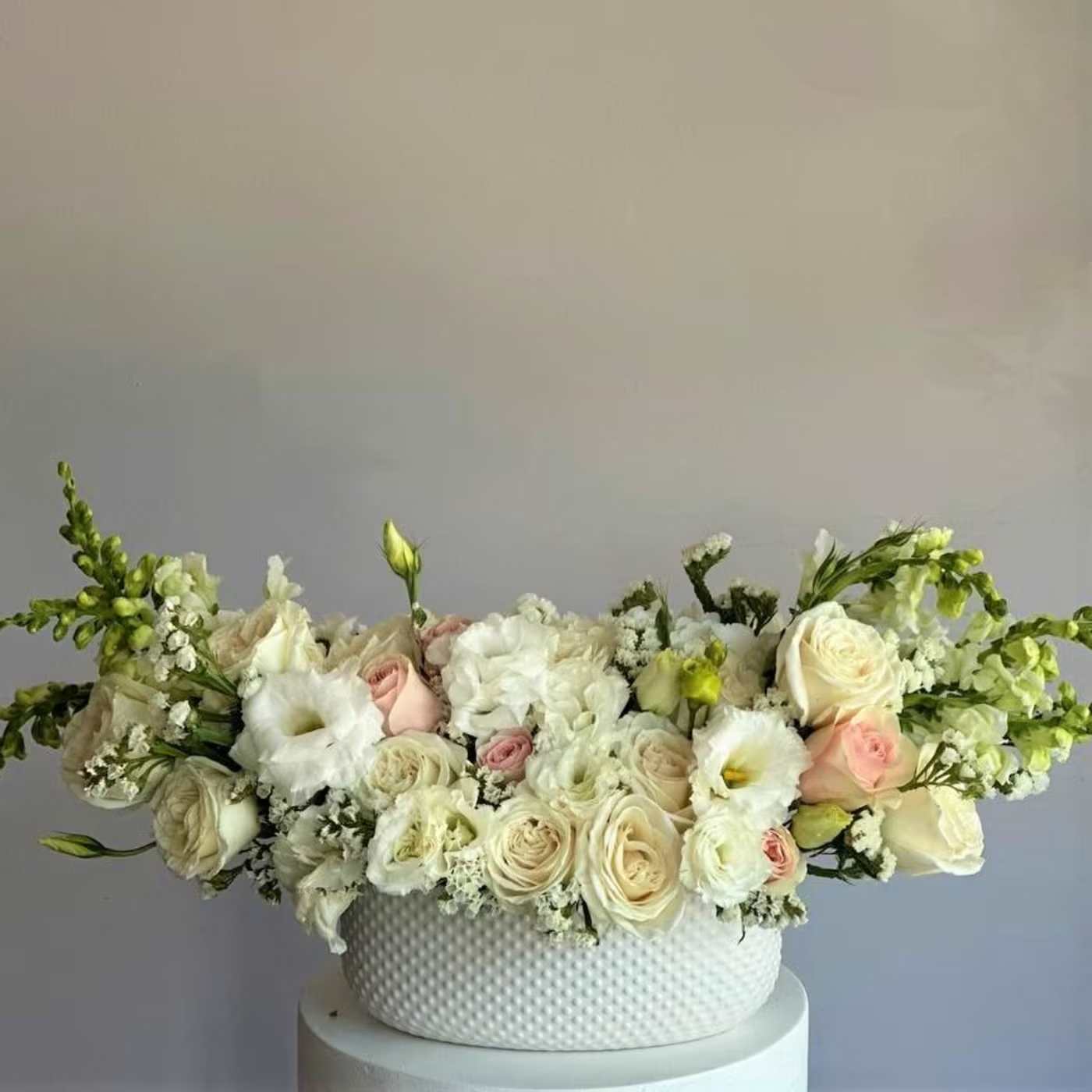 #40 Nora  - Soft, graceful, and full of gentle warmth — the Nora bouquet is designed to bring a quiet joy to any space or occasion. With its pastel tones, airy textures, and elegant balance of color, Nora speaks in whispers of love, thoughtfulness, and beauty.  shown an actual size &quot;Deluxe&quot;  Seasonal flowers can be replaced with a similar one. Wraps can also be replaced with others.
