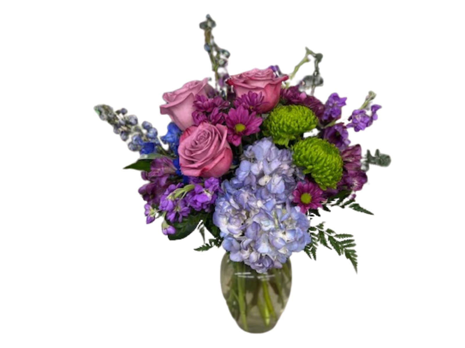 Twilight Twilight - This moody mix of blues, purples, and greens features roses, hydrangeas, delphinium, and other long-lasting flowers for a statement arrangement.