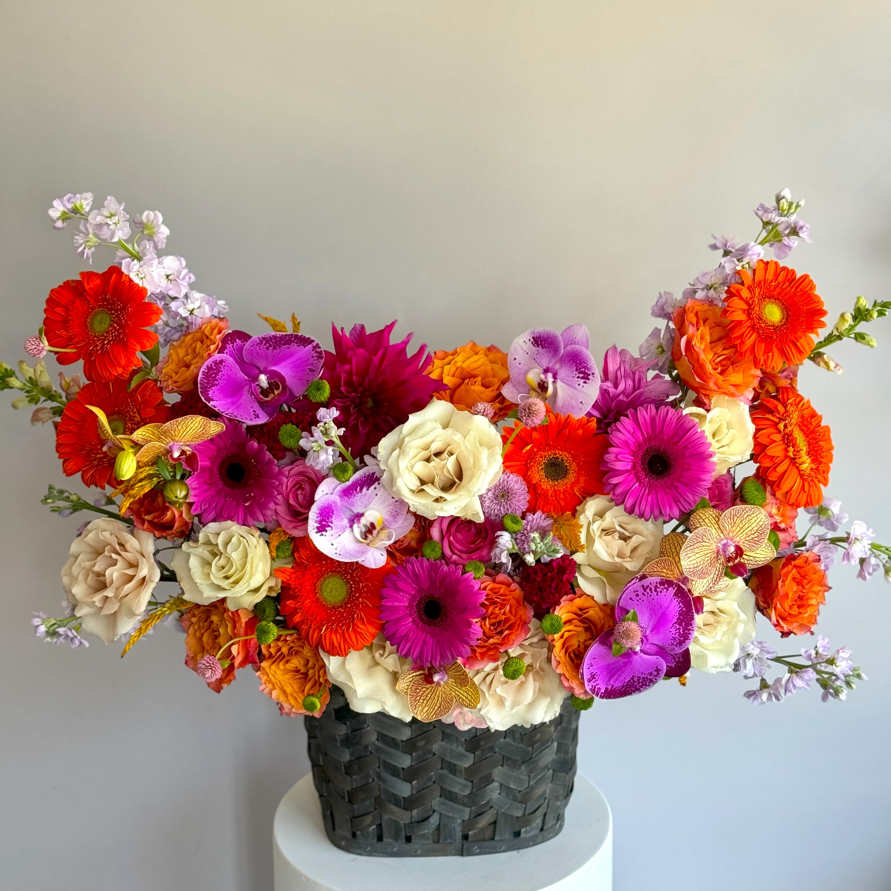 #33 Amber basket - Amber of different and colored flowers in huge basket that will give a lot of smiles and good vibe. Available in different colors, please specify in which tone you would like shown an actual size &quot;Deluxe&quot;  Seasonal or not available flowers can be replaced with a similar one. Baskets can also be replaced with others