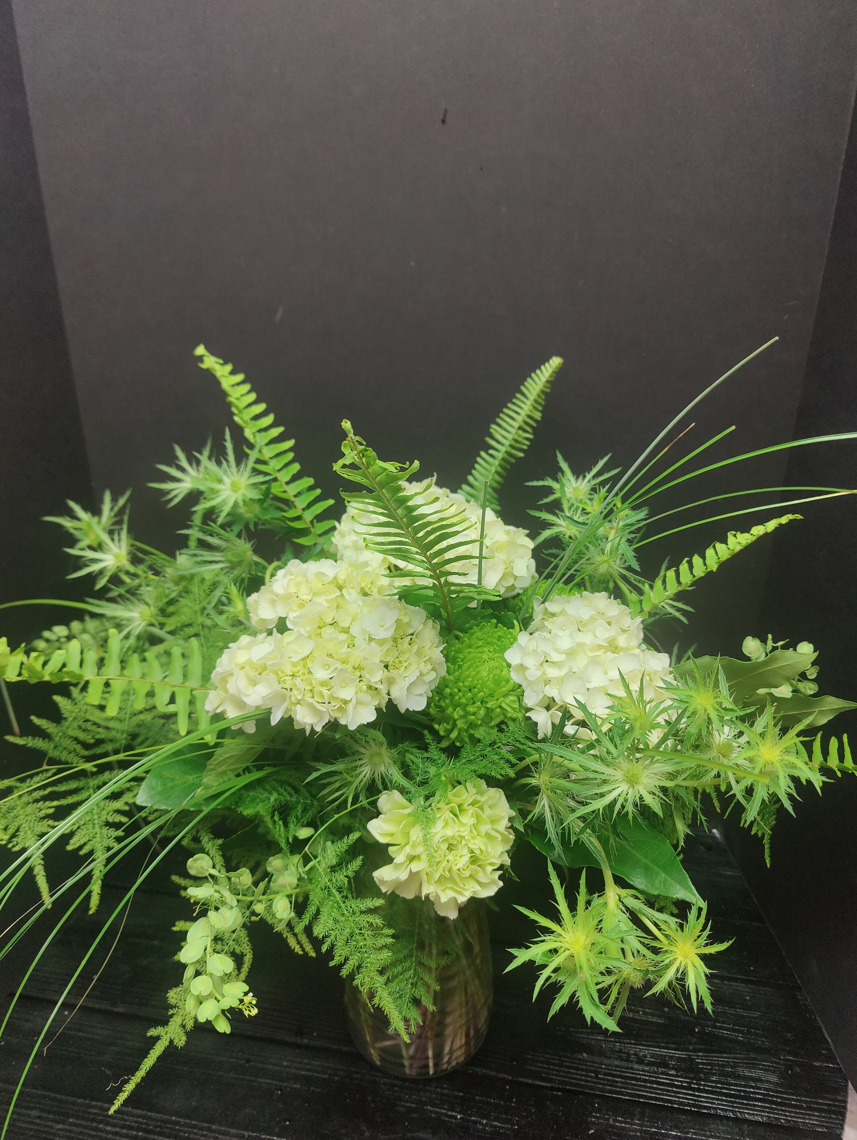 Green with envy  - A arrangement of green seasonal flowers along with assorted vegetable greens!