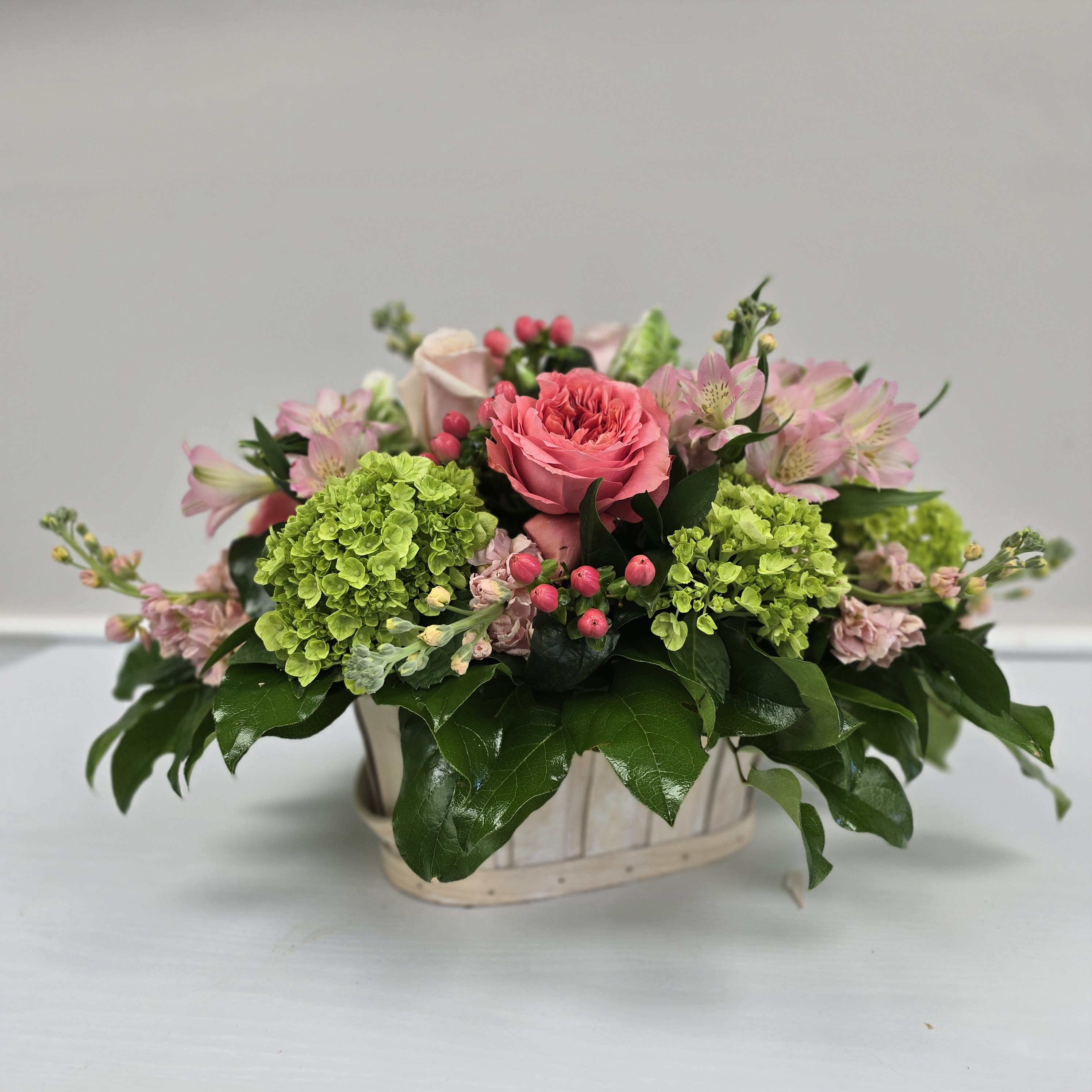 Colors of Cotuit - Beautiful Spring blooms of pinks peaches and spring green will make you think spring time on Cape Cod.    *Container and Flowers may differ slightly from what is shown in the picture depending on availability and season