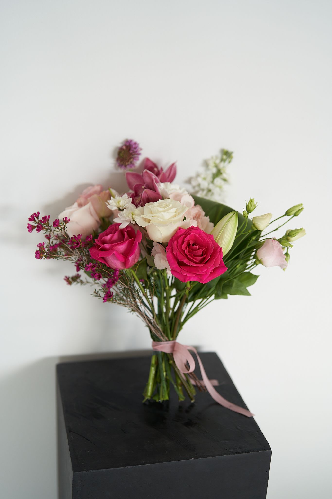 Elegant  - *The selection of blooms varies seasonally* *The photo shows only a sample of the color palette and style. The final arrangement will be similar to the photo but will have unique and distinctive characteristics* 