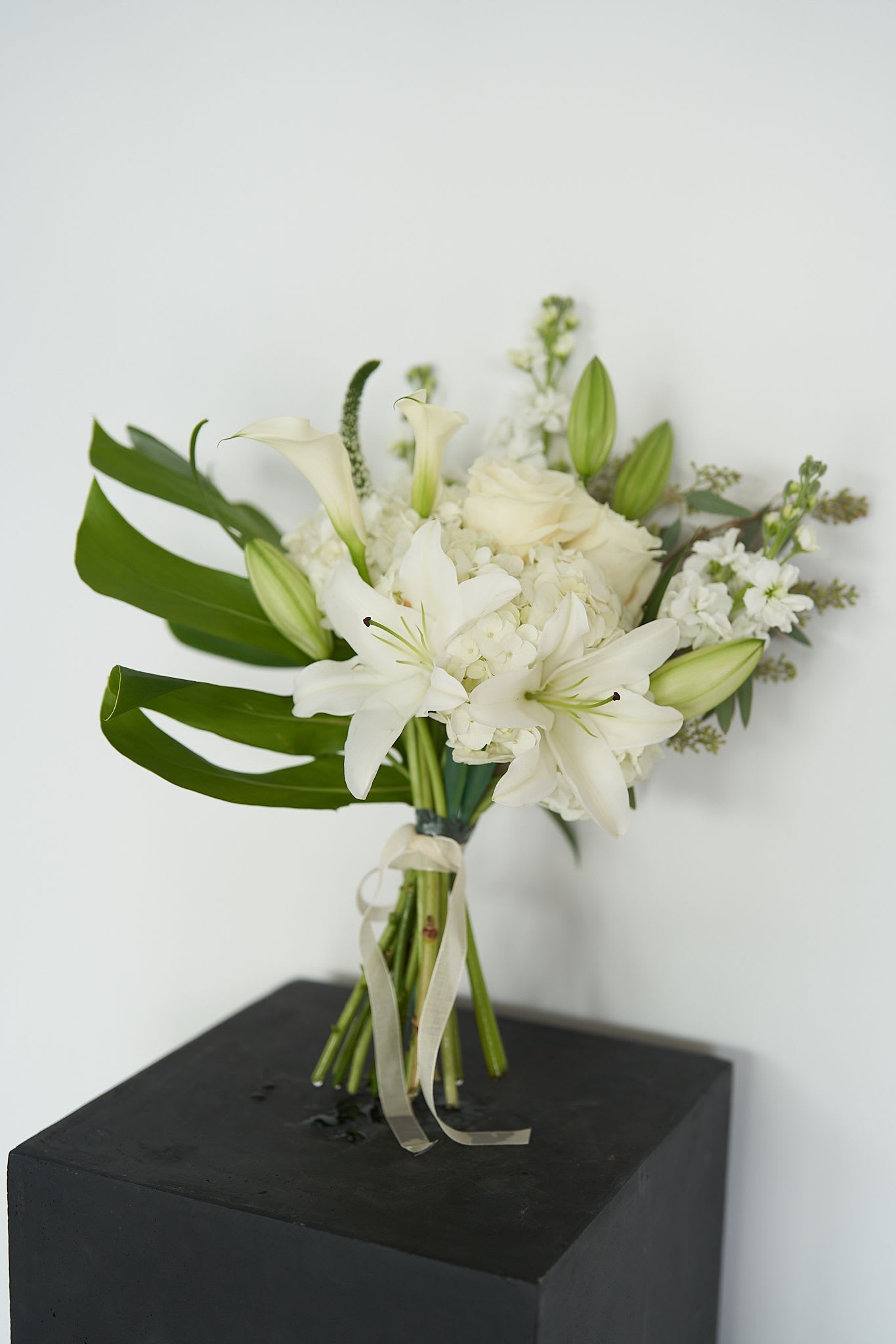 Monochrome - *The selection of blooms varies seasonally* *The photo shows only a sample of the color palette and style. The final arrangement will be similar to the photo but will have unique and distinctive characteristics* 