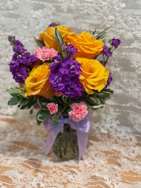 Golden Mardi Golden Mardi - Half dozen golden rose, purple stock and mini carnations in a mason jar.