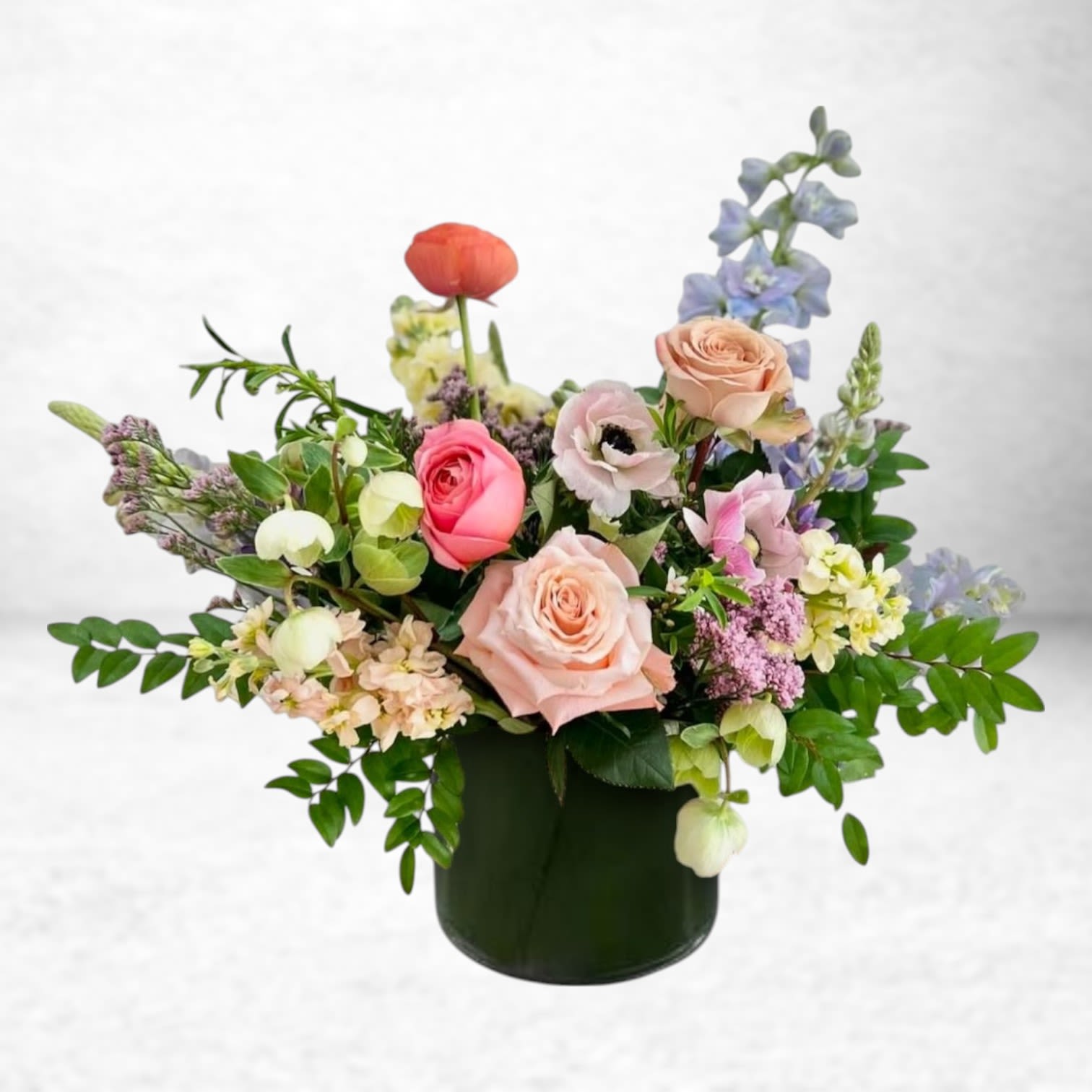 Whispers of Care - Delicate and heartfelt, Whispers of Care is a graceful expression of thoughtfulness. Featuring soft blush roses, peach spray roses, light blue delphinium, creamy hydrangea, and lilac stock—this garden-style arrangement offers a gentle reminder that someone is loved and remembered. Whether you’re sending encouragement, comfort, or a simple hello, this bouquet brings beauty and connection with every petal.  Available for same-day flower delivery in Houston and surrounding areas including Galveston, Friendswood, and League City.  Substitution Disclaimer: We take great pride in using the freshest seasonal blooms available. Occasionally, specific flowers or colors may need to be substituted, but we always maintain the design’s integrity, quality, and overall aesthetic.  