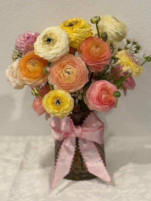 Ranunculus Charm Ranunculus Charm - One dozen mixed ranunculus arrangement in a glass vase