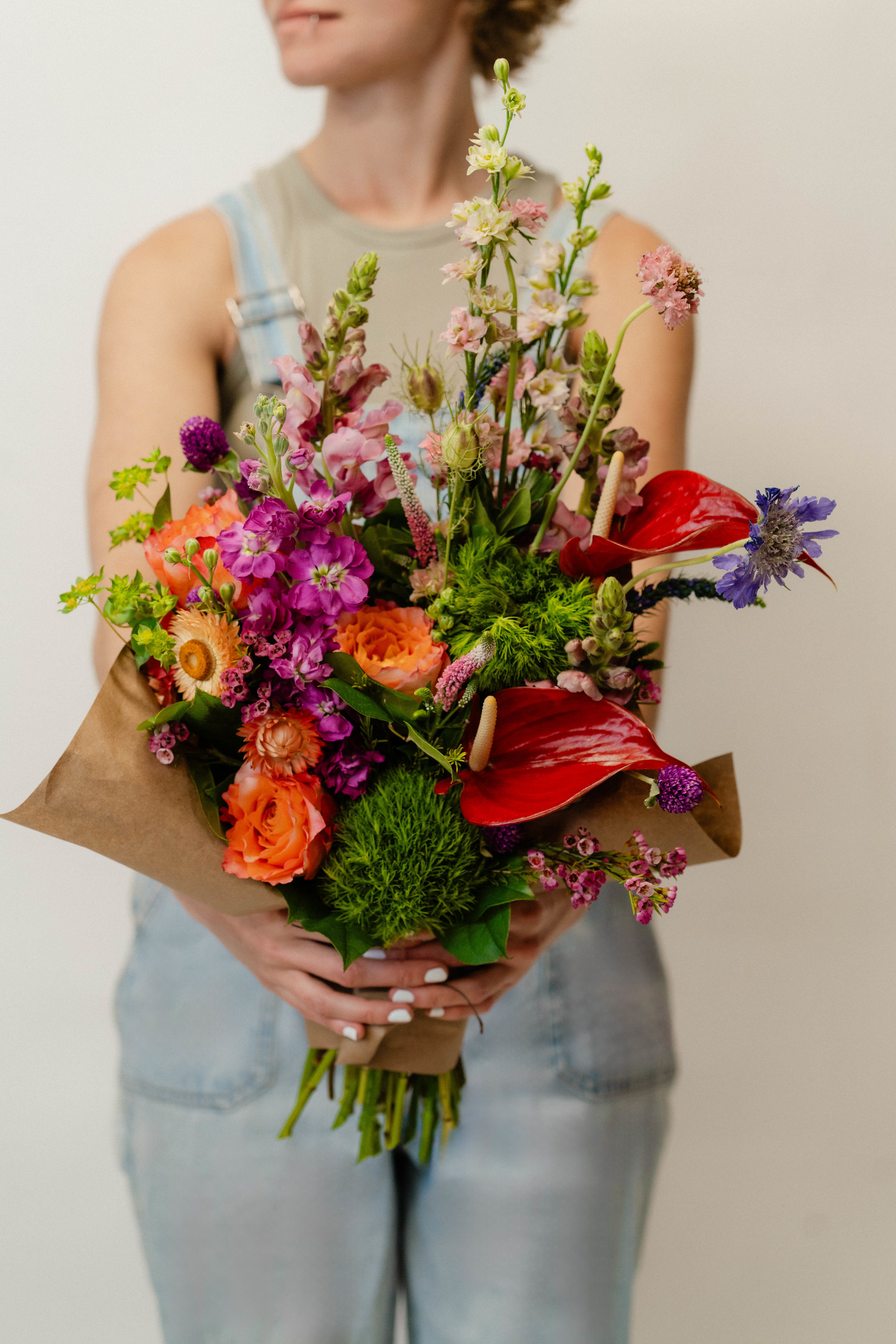 Deluxe Hand-tied Bouquet - Extra Large Luxe Bouquet - 34-36 stems (depending on price and availability) of high-end, fresh flowers and greenery - wrapped in a nice paper for protection and presentation. A big, showy, and bouncy bouquet that is sure to wow for any occasion!     *Please note - hand-tied bouquets DO NOT come in a vase with water*