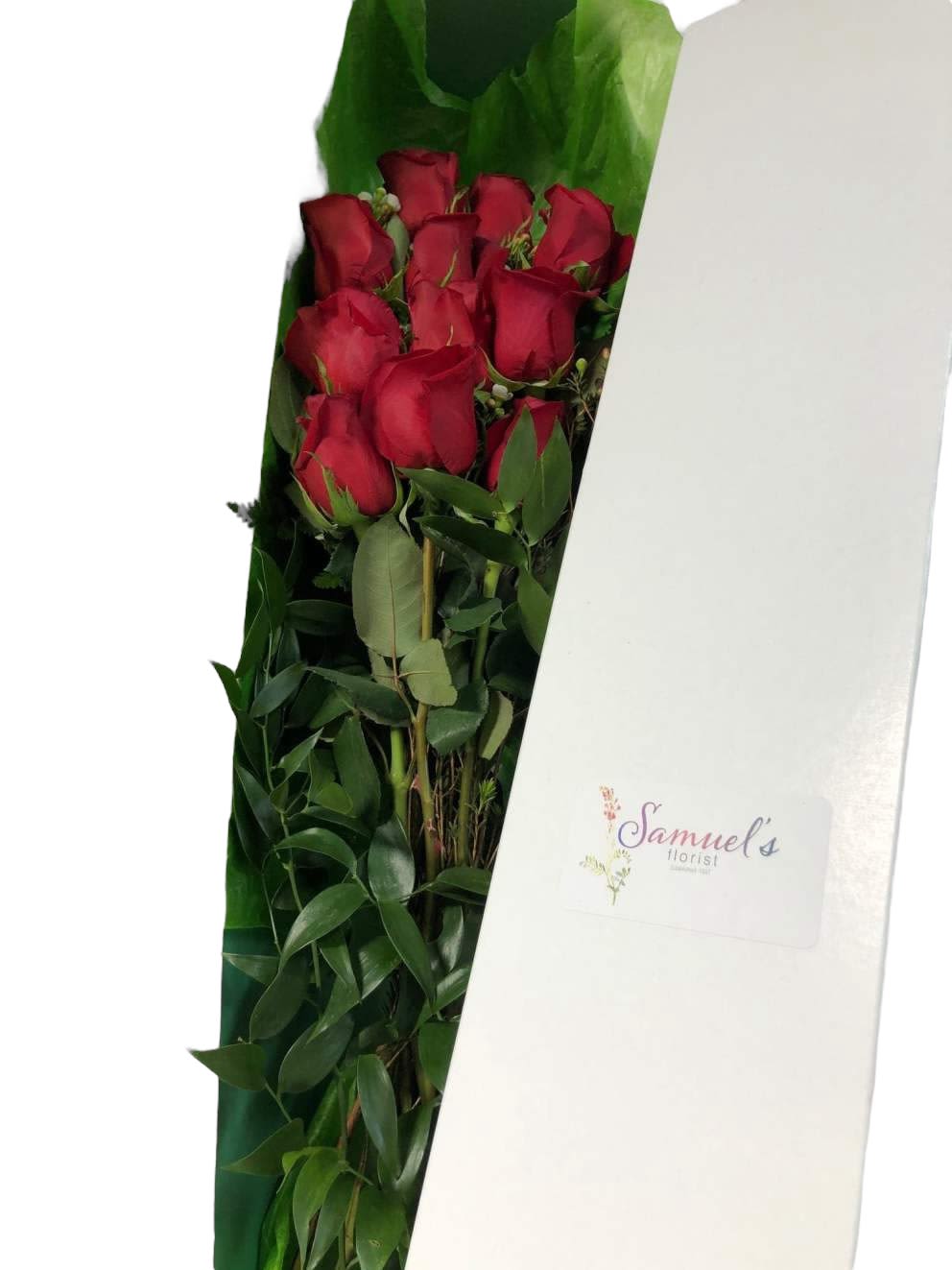 Classic Boxed Roses - Envoke the Golden Age of Hollywood by sending your leading love a box of roses, such a timeless and elegant gift. One dozen Ecuadorian roses, with greens and assorted accents in a white box with a bow. Each perfect rose is in a water vial to lengthen vase life. PERFECTION! 