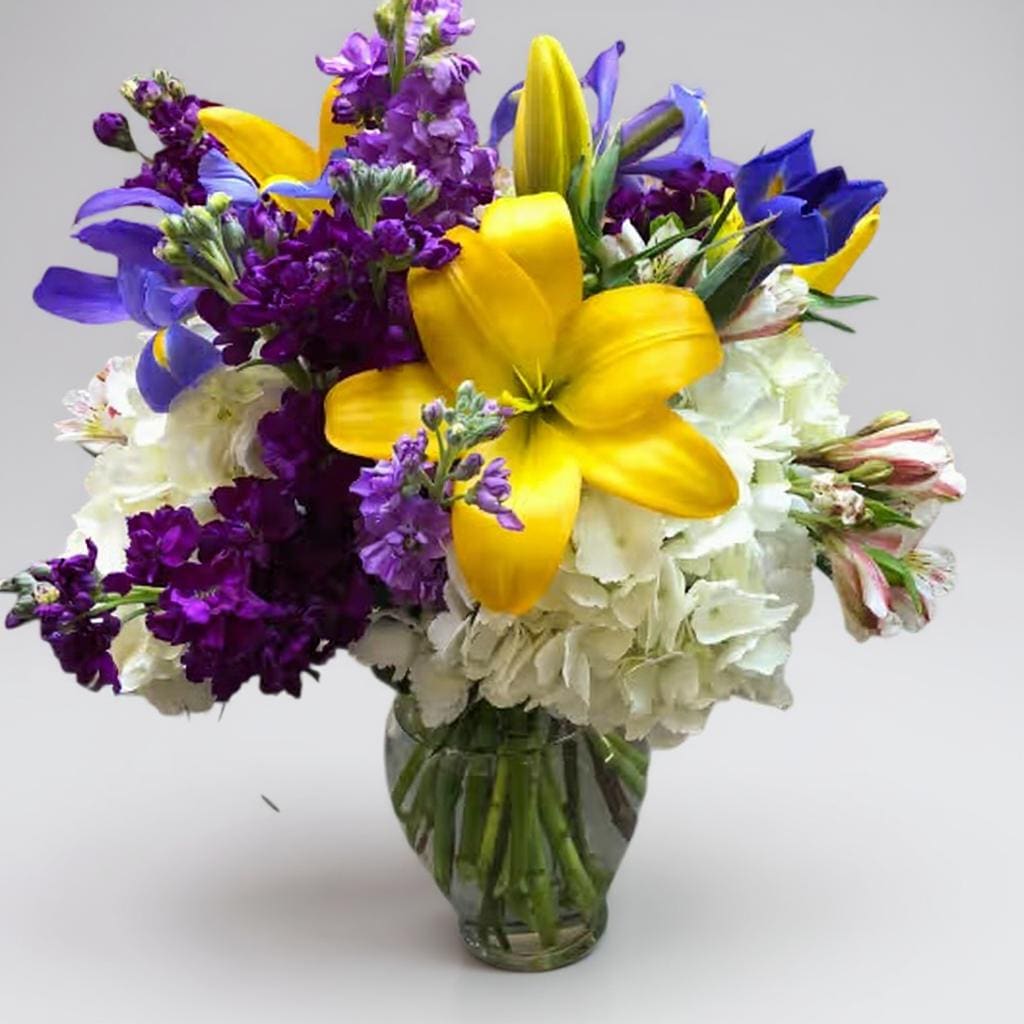 You are my Sunshine - Send a bright, colorful, sunny arrangement to let them know how much they affect your live. Bright blue iris with purple stock and yellow lilies will brighten anyone's day. 