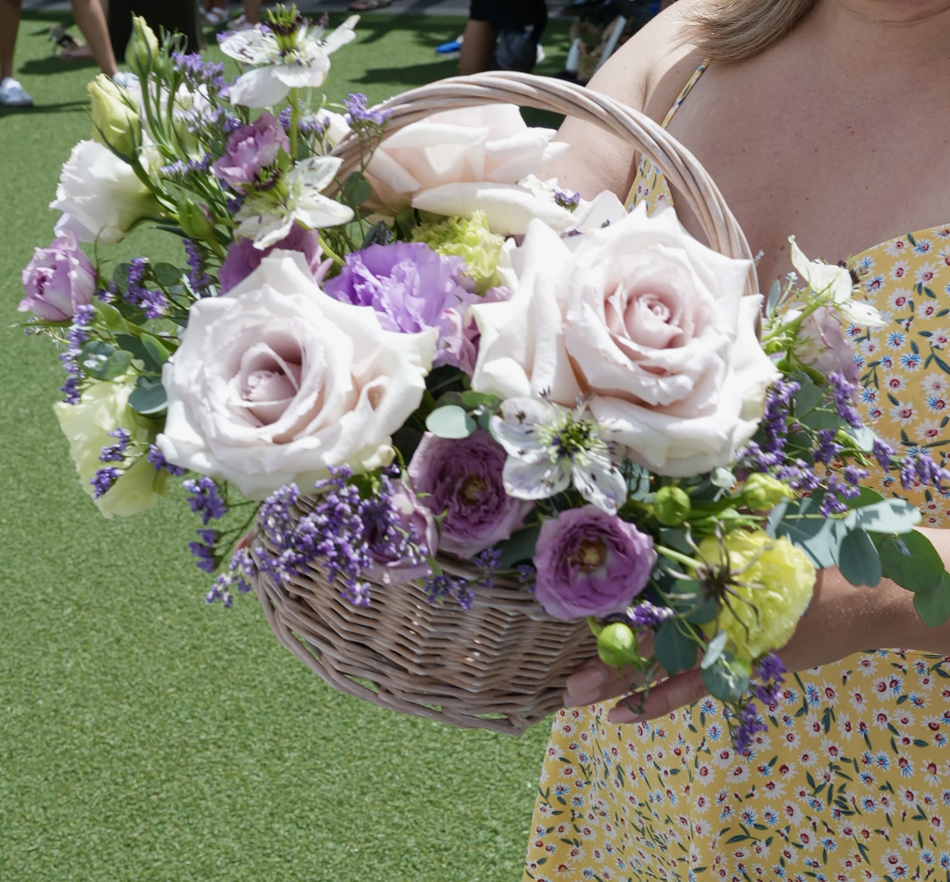 Pastel Poem -  A delicate ode to beauty and calm, Pastel Poem is a graceful basket arrangement woven from the softest shades of nature. Blush garden roses, lavender and green lisianthus, airy nigella, and violet-hued statice come together in perfect harmony — like verses of a love poem written in petals.  Whether gifted in celebration or in comfort, this arrangement whispers elegance and thoughtfulness with every bloom.  Style: Romantic, graceful, poetic Fragrance: Light, fresh, and floral