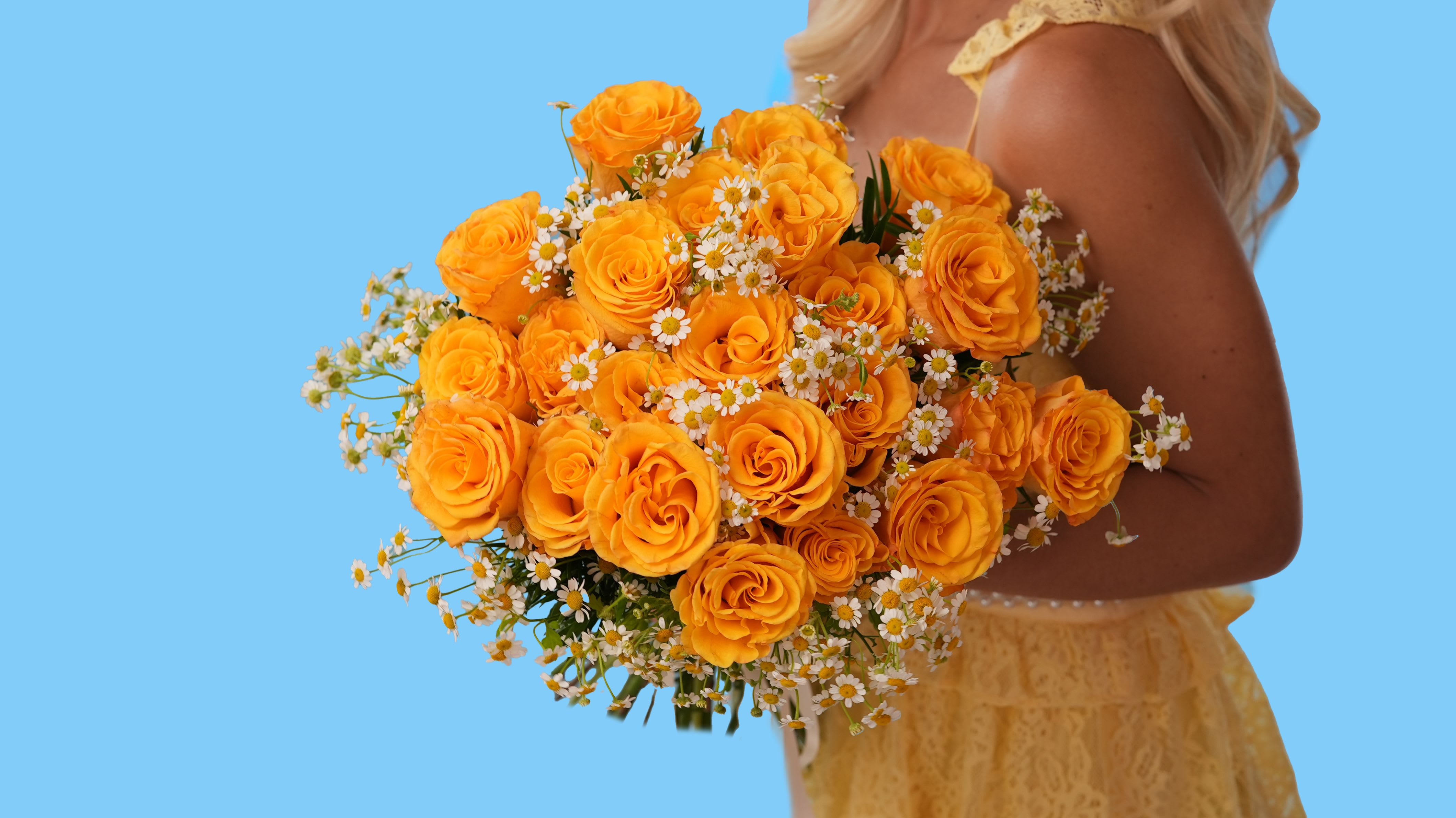 Morning Honey - Bright as the first light of day and sweet as its name, Morning Honey is a golden delight that captures warmth, happiness, and charm in every bloom. This joyful arrangement features rich amber-yellow roses paired with delicate chamomile daisies, creating a fresh-from-the-meadow feel with an upscale twist.  Whether you're sending sunshine, celebrating new beginnings, or just bringing warmth into a space, Morning Honey is the perfect way to make someone smile.  Style: Cheerful, elegant, naturally radiant Fragrance: Light and subtly sweet