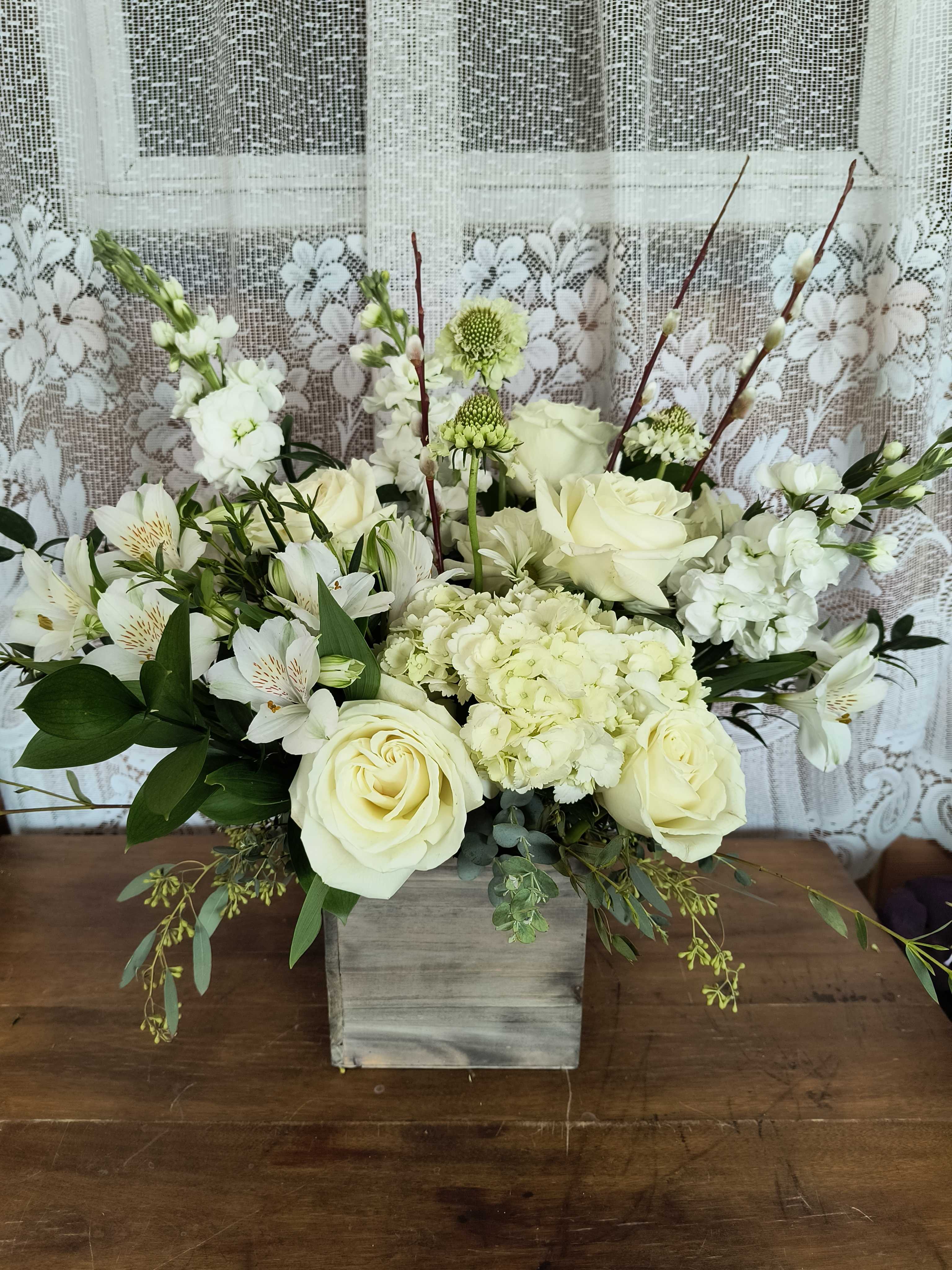 Blanche - Snowy white blooms in a woodland planter box. 