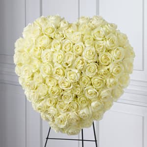 The FTD Elegant Remembrance Standing Heart - The FTD&reg; Elegant Remembrance&trade; Standing Heart is an exquisite display of peace and love. 77 stems of white roses are artfully arranged in the shape of a heart and presented on a wire easel creating a simply beautiful tribute for their final farewell service.