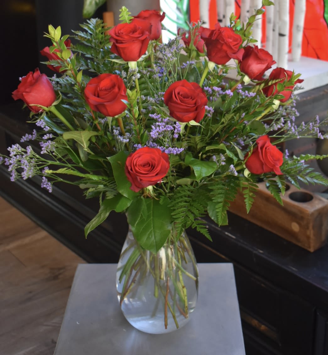 The Classic Dozen - Each arrangement is custom designed, using seasonal, best-of-day blooms. The image shown represents its size, style and temperament, however certain flowers may be substituted to achieve the best quality and longevity for your florals.