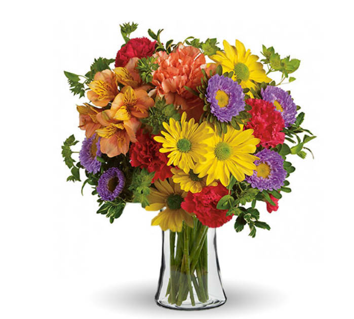  Make a Wish Bouquet - Cheery fresh seasonal blooms, such as daisy poms, alstroemeria, miniature carnations, and poms or asters, in a compact vased bouquet. Sure to brighten anyone's day. Great for a birthday, get well, thanks, congratulations, or just because (Photo © BloomsToday)