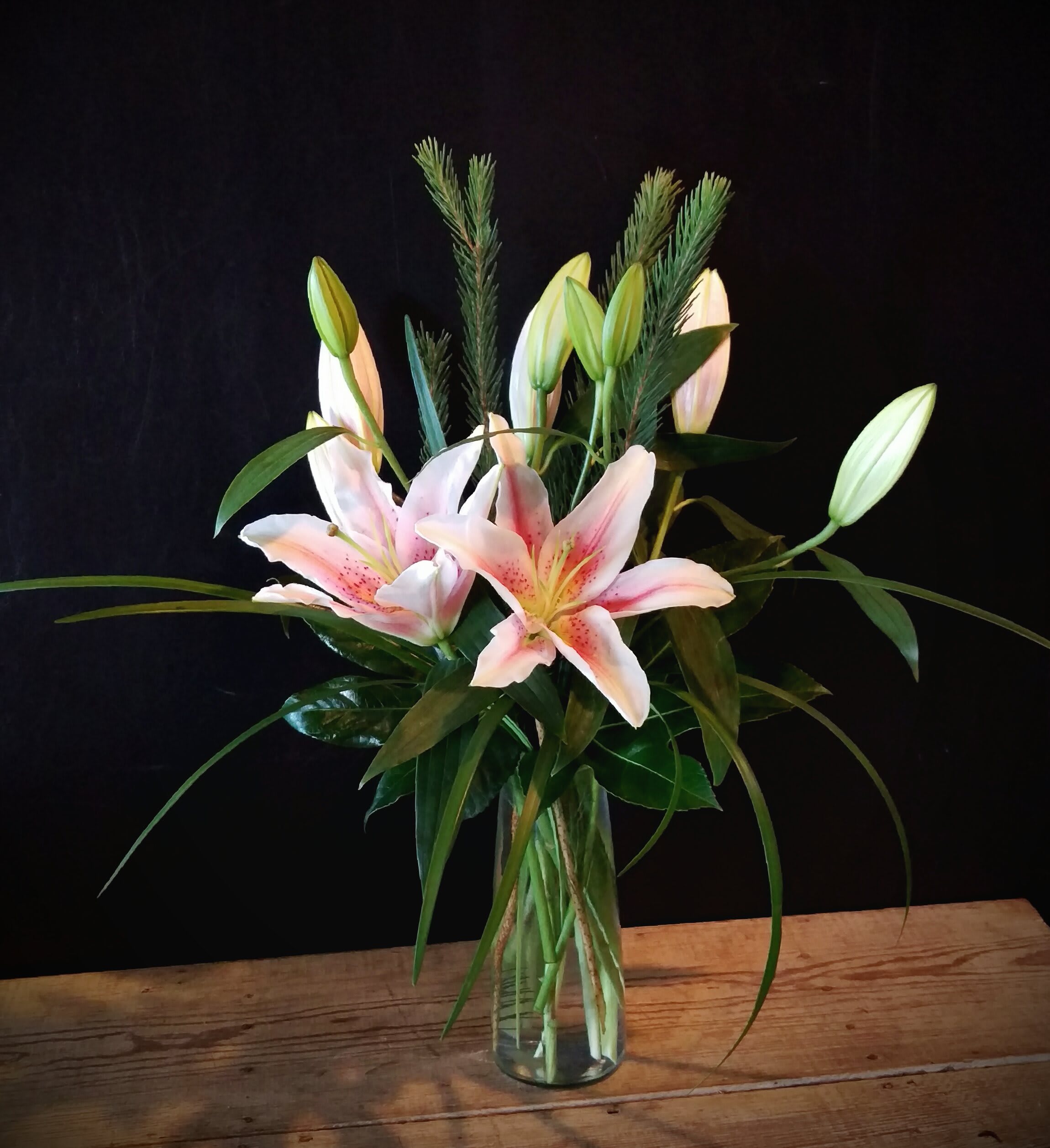 Lily Bouquet (colors vary) Lily Bouquet (colors vary) - Send this sweet bouquet ..... Fragrant Oriental lilies are accented with grass and arranged in a clear glass vase.