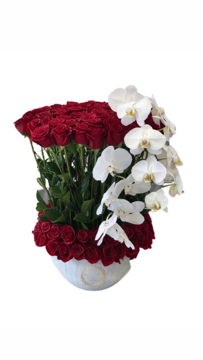 Love and Orchids  - Luxury ceramic vase with standing long stem red Ecuadorian roses and a touch of luxury with cascading orchids. 
