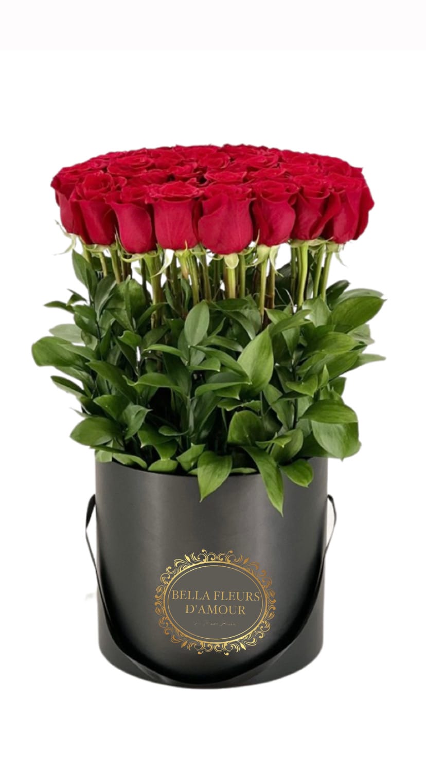 Romance - Two dozen long stem Ecuadorian roses in our luxury round box available in black or white 