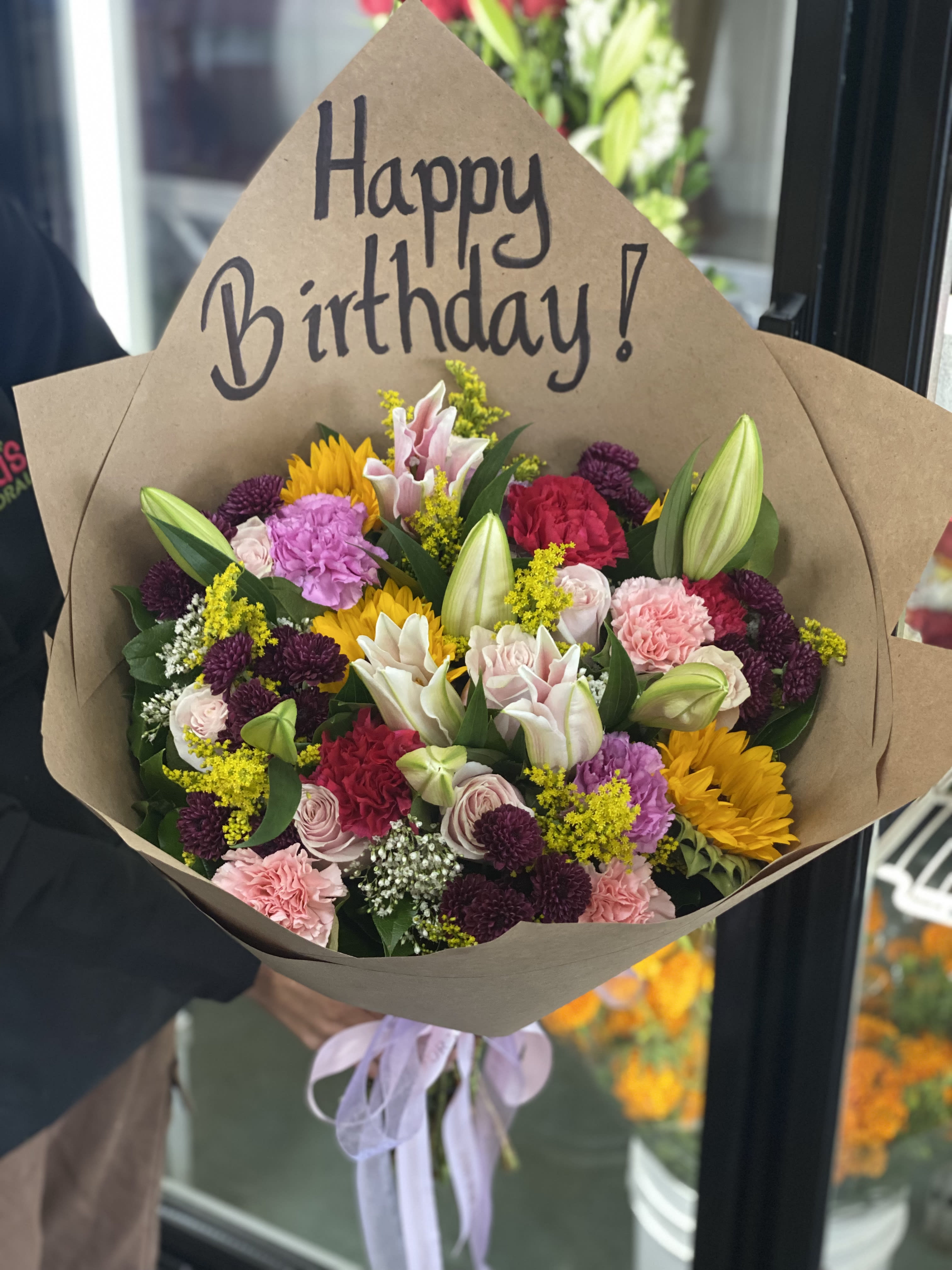 Happy Everyday Mix Bunch - A mix of all our everyday stocked flowers! WRITING INCLUDED. You can change paper writing during checkout under instruction box (final step). Request it in Soft colors, Bright Colors, Romantic Colors, etc.  Wrapped in our brown paper. You are welcome to request it in Black or White Floral. 