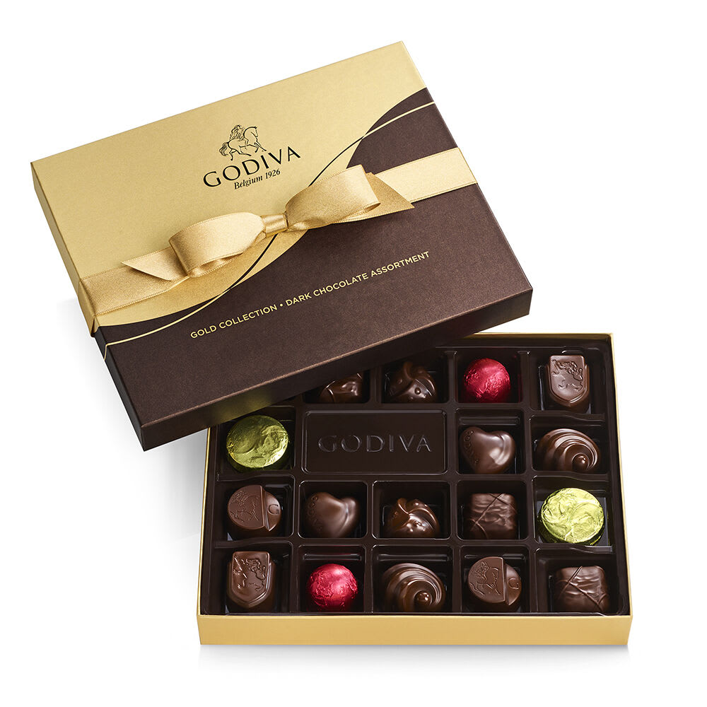 Godiva Dark Chocolate Assortment (18pc) Godiva Dark Chocolate Assortment (18pc) - Godiva Dark Chocolate Assortment (18pc) Indulge in the rich and luxurious flavors of the Godiva Dark Chocolate Assortment. This exquisite collection includes 18 pieces of Godiva's finest dark chocolates, each crafted to perfection to provide a truly delightful experience. Key Features: Premium Quality: Made with the finest ingredients, Godiva's dark chocolates are known for their rich, smooth texture and exceptional taste. Variety of Flavors: This assortment includes a selection of Godiva's most popular dark chocolate pieces, offering a variety of delicious flavors in every box. Elegant Presentation: Each piece is carefully crafted and elegantly packaged, making it perfect for gifting or enjoying as a special treat. Perfect for Any Occasion: Ideal for birthdays, anniversaries, holidays, or any celebration where you want to indulge in premium chocolates. 18 Pieces: This assortment includes 18 delectable dark chocolate pieces, ensuring there's plenty to savor and share. Treat yourself or someone special to the exquisite taste of Godiva Dark Chocolate Assortment. Each piece is a testament to Godiva's dedication to quality and craftsmanship, providing a memorable and indulgent chocolate experience.