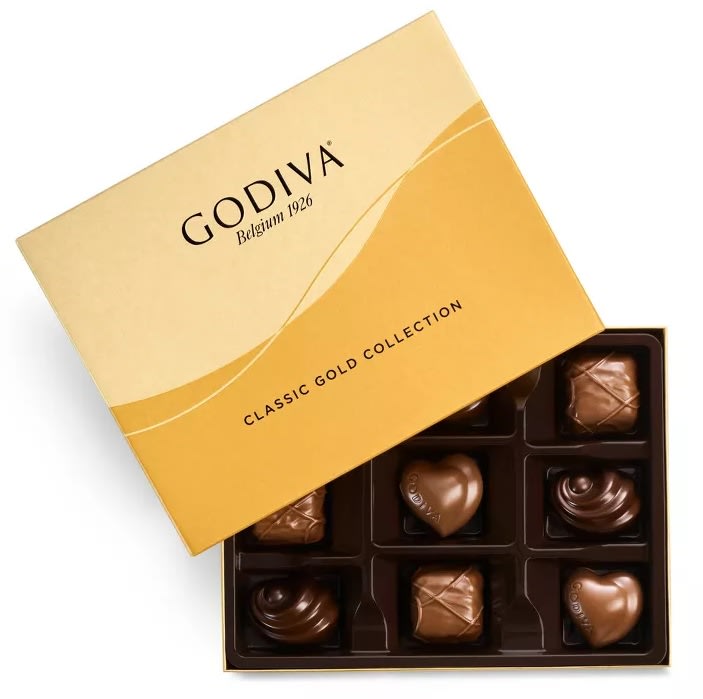 Godiva Premium Chocolates (9pc) - Experience the ultimate in chocolate luxury with Godiva Premium Chocolates. This elegant box features a curated selection of 9 exquisite pieces, each crafted from the finest ingredients to deliver a rich and unforgettable taste experience. Whether you’re treating yourself or gifting a loved one, this assortment offers a delightful mix of textures and flavors, showcasing Godiva’s mastery in chocolate-making.  Key Features:  Exquisite Selection: A variety of 9 premium chocolates, each with unique flavors and textures. Finest Ingredients: Made with top-quality ingredients for a truly indulgent taste. Perfect Gift: Ideal for special occasions, thank you gifts, or personal enjoyment. Elegant Packaging: Presented in a beautifully designed box, ready for gifting.