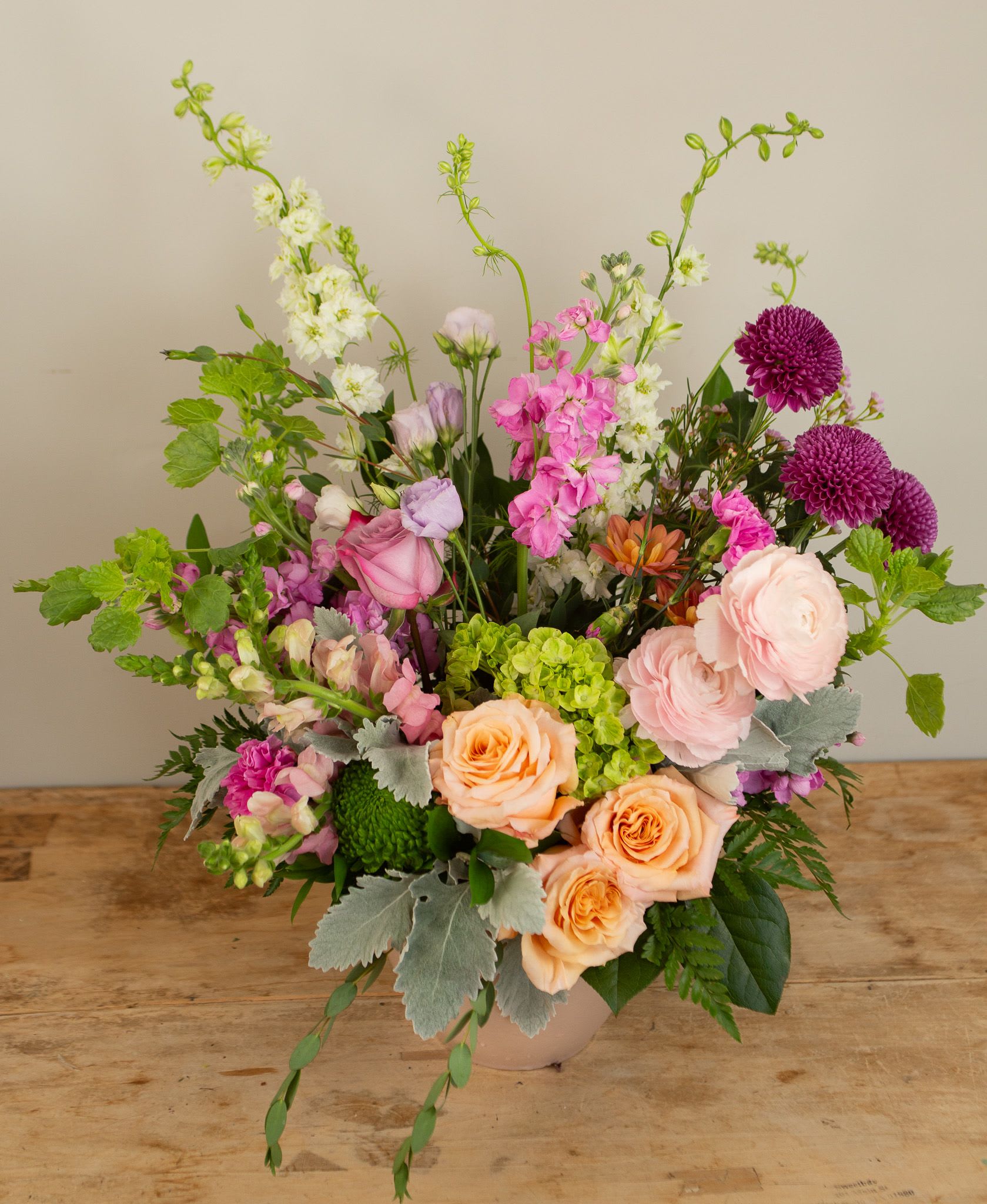 Pink Sympathy Tribute - A lush and elegant floral display, filled with color and warmth in honor of a beautiful life.  Pictured is standard size. 