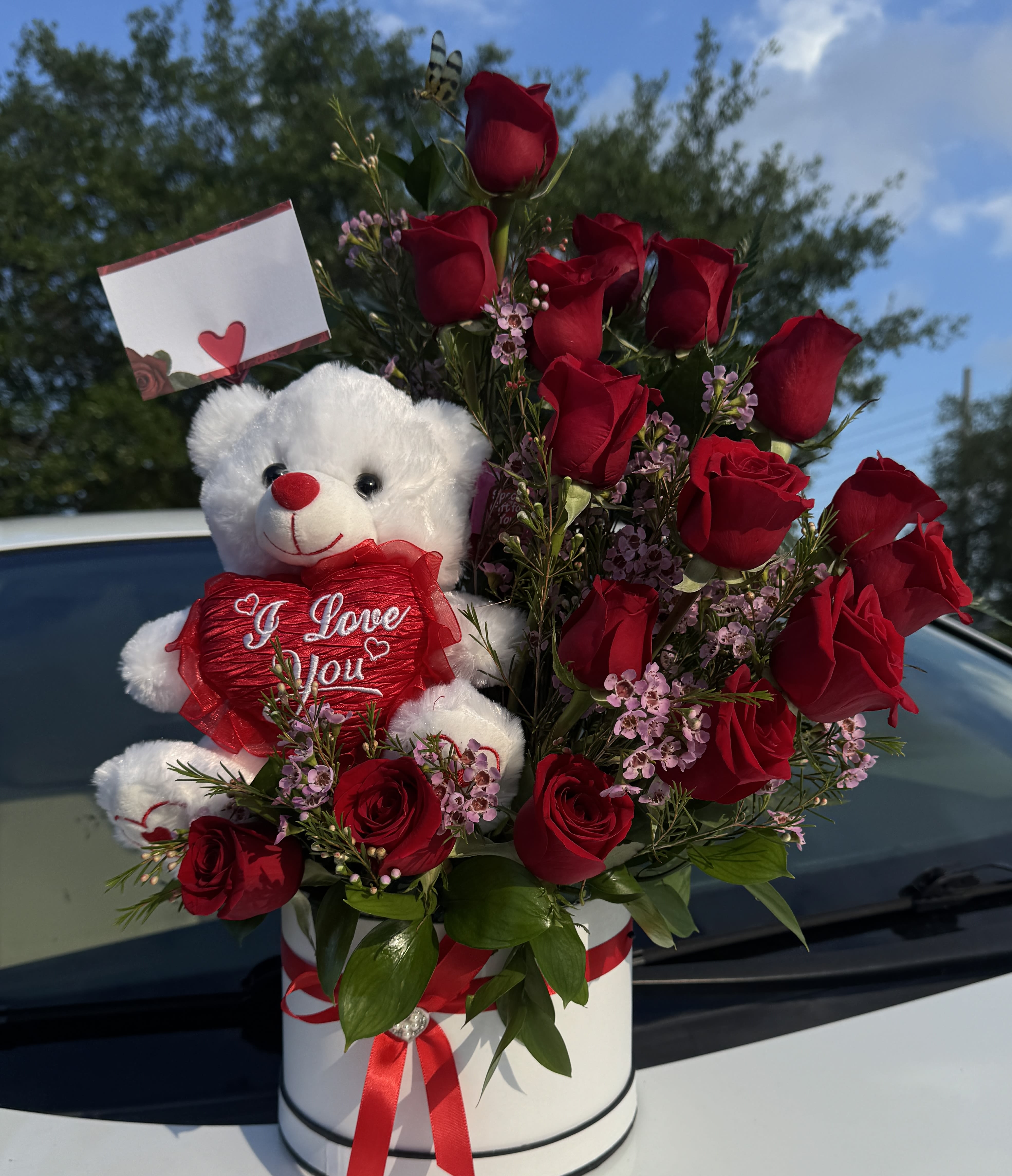 BEAR IN LOVE - Sweet arrangement with roses, delicate blooms, and a cuddly teddy bear.