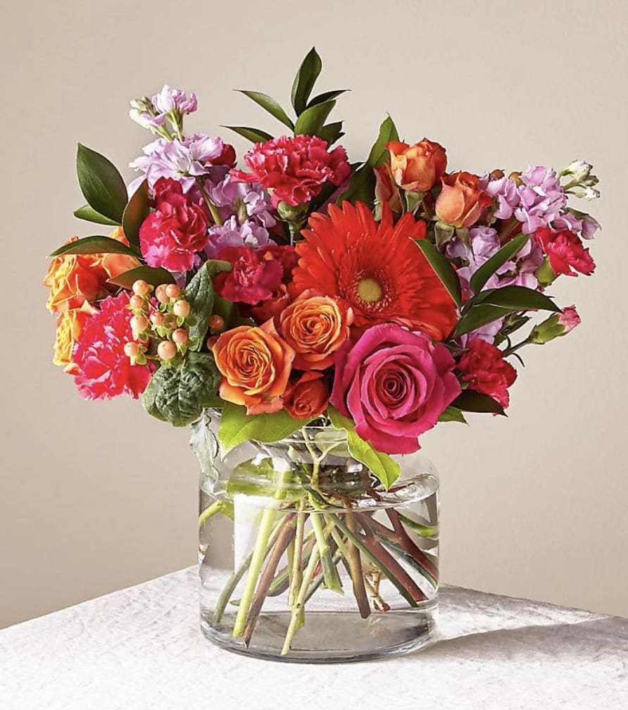 Sunny Splash - Send a sunny splash of color and brighten their day with this vibrant bouquet of 10 Alstroemeria, mixed with 6 multi-colored roses. Symbolic of friendship and devotion, each stem of Alstroemeria has multiple blooms and is sure to warm their heart.