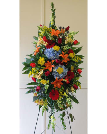 Colorful Compassion Spray Colorful Compassion Spray - In this standing spray there is s great mixture of our fresh flowers. You see Hydrangea, Snap Dragons, Lilies, Roses, Carnations, Alstreomeria, and Gerbera Daisies. All flowers and colors are subject to change due to availability. FCF-0188
