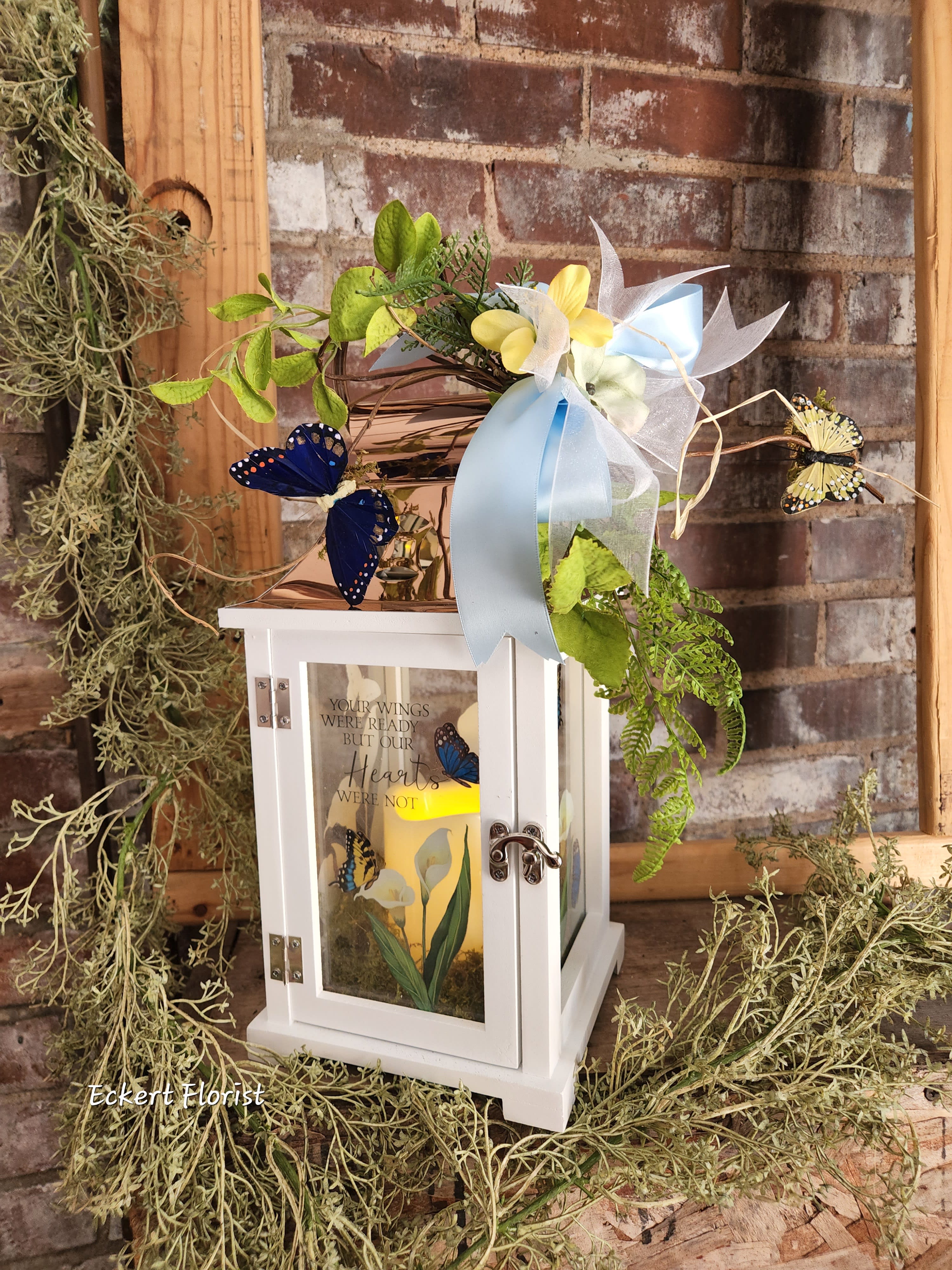 Eckert Florist's Your Wings Lantern - Nice keepsake white wooden lantern with copper tin roof and sentiment on Calla Lily and butterfly motif glass. Sentiment: &quot;Your wings were ready but our Hearts were not&quot; Included is a battery operated candle. Measures approx. 6.25&quot; Square x 15&quot; High *OUR LOCAL DELIVERY ONLY