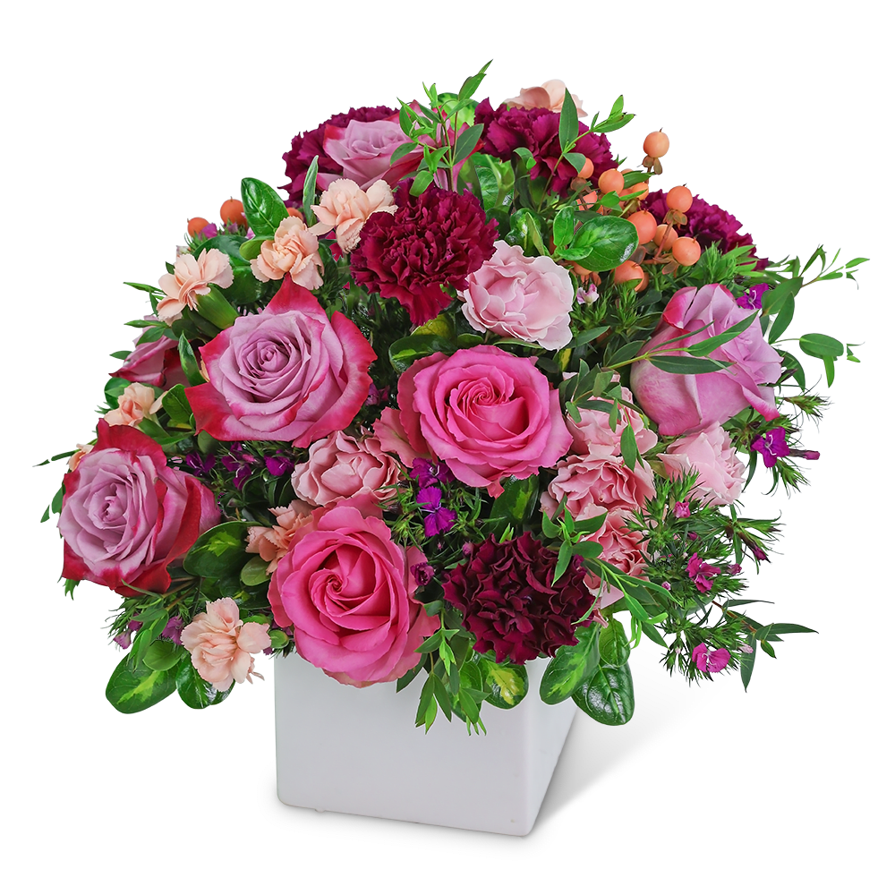 Manhattan Luxe - With its lush pinks and purples, this flower arrangement is as classic as its namesake. Manhattan Luxe features roses, carnations, hypericum berries, and assorted foliage in a sleek white container. This bouquet is a stunning gift for any occasion! We offer same-day flower delivery in most cases and pride ourselves on being the best local florist with our unique designs and excellent customer service.