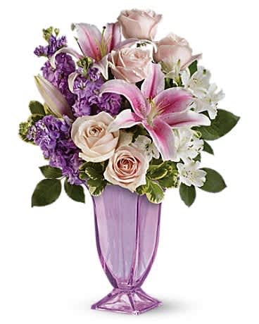 Always Elegant Bouquet by Teleflora Always Elegant Bouquet by Teleflora - This is it - pink roses and fragrant pink lilies in an exquisite coloured or clear glass vase. Pastel perfection!! The charming bouquet includes light pink roses, pink oriental lilies, white alstroemeria and lavender stock, accented with lovley greens in a cooured or clear vase.