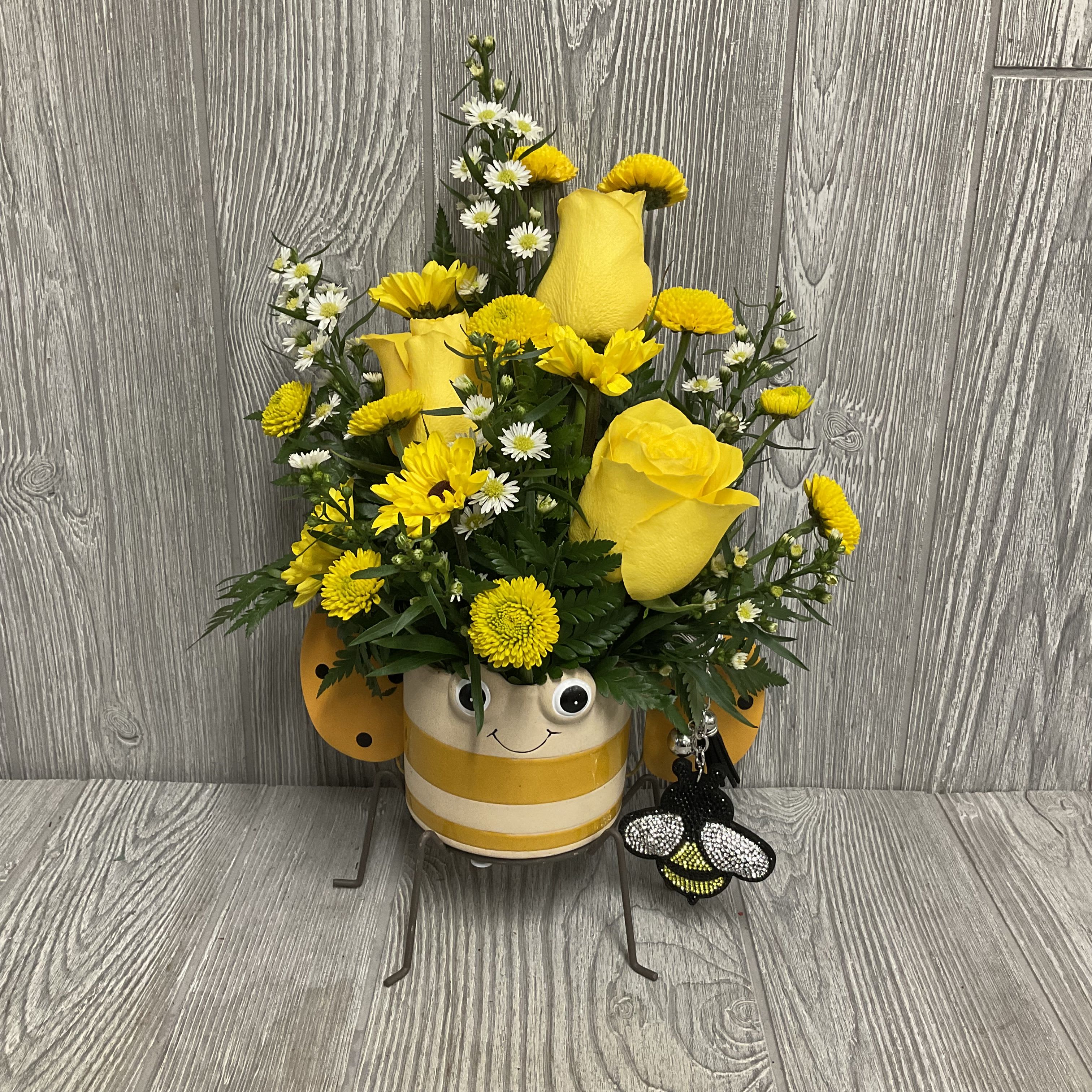 Buzzin’ Blooms - This will bee a great gift for your Omega Phi Alpha daughter or sister and will bee all the buzz. Included in the reusable bee container will bee a rhinestone bee keychain. 