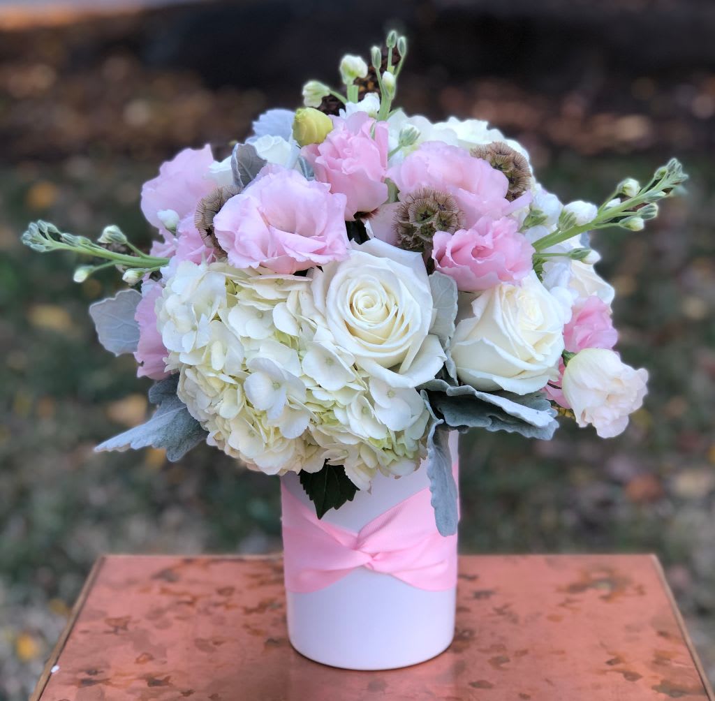 The Fee Fee - The Fee Fee Soft, graceful, and timeless, The Fee Fee is a delicate floral arrangement handcrafted by Petals Flowers and Fine Gifts, your premier local florist in Wilmington, Delaware. This elegant design features lush white hydrangea, charming light pink lisianthus, classic white roses, and fragrant white stock, all thoughtfully gathered and finished with a light pink bow for the perfect touch of sweetness.  Ideal for birthdays, anniversaries, new baby celebrations, or simply to let someone know you care, The Fee Fee exudes gentle beauty and refined style. It’s a lovely choice to brighten a home, office, or special event.  Why Choose Petals Flowers and Fine Gifts in Wilmington, DE?  * Boutique florist located in Wilmington, Delaware, known for luxurious, custom floral arrangements * Same-day flower delivery available in Wilmington, Hockessin, Newark, Chadds Ford, Kennett Square, and surrounding areas * Enjoy tax-free shopping, exceptional customer care, and our satisfaction guarantee on every order Order The Fee Fee today from Wilmington’s trusted local florist and share the joy of flowers beautifully arranged with care and heart.
