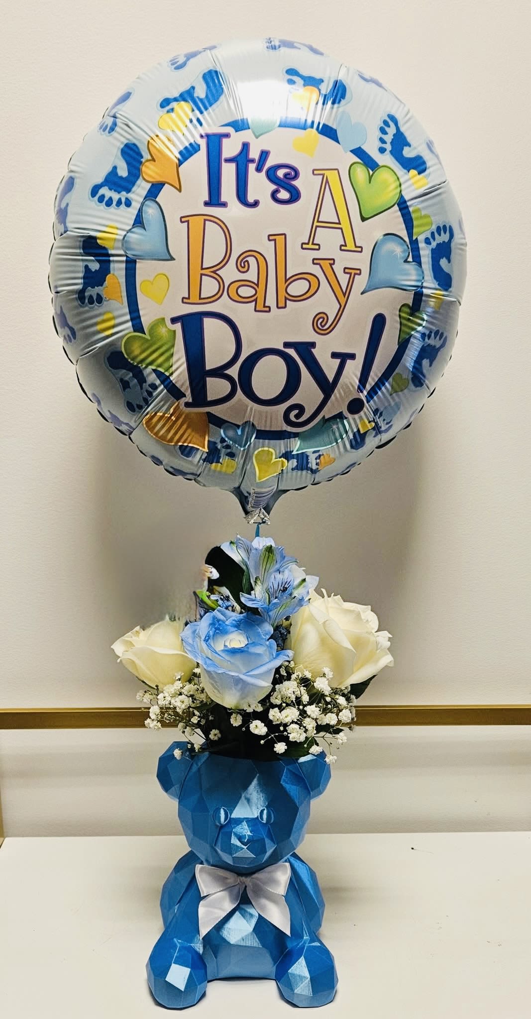 baby boy bouquet. baby boy bouquet. - tender arrangement to celebrate the birth of a baby or centerpiece for any event. includes 1 balloon, blue or white roses, alstromeria, and baby’s breath, if available if not, it will be substituted with another type of foliage.