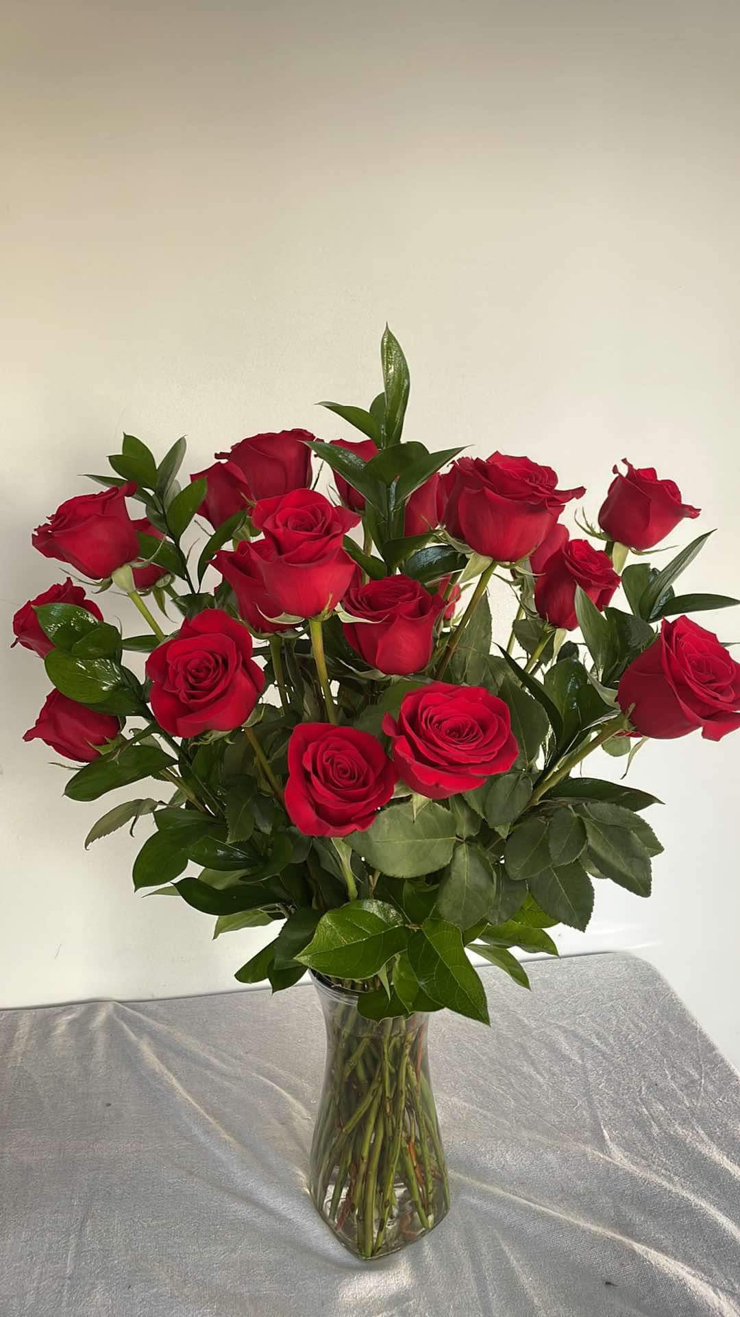 Two Dozen Long Stemmed Roses by BloomNation™ - These two dozen red roses provides the classic romantic gift. It's perfect for Valentine's Day or an Anniversary. APPROXIMATE DIMENSIONS: 30&quot; H X 22&quot; W