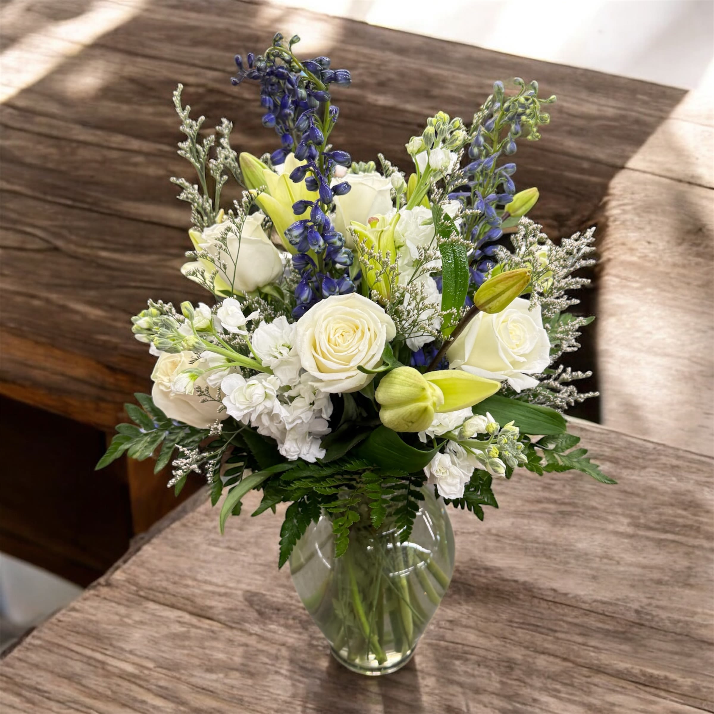 Designers Choice Sympathy Bouquet - Our Designer’s Choice Sympathy Bouquet is a thoughtfully handcrafted arrangement, created with the freshest seasonal blooms in soft, comforting tones. Each bouquet is uniquely designed to offer heartfelt condolences and bring a touch of peace and beauty during a difficult time.