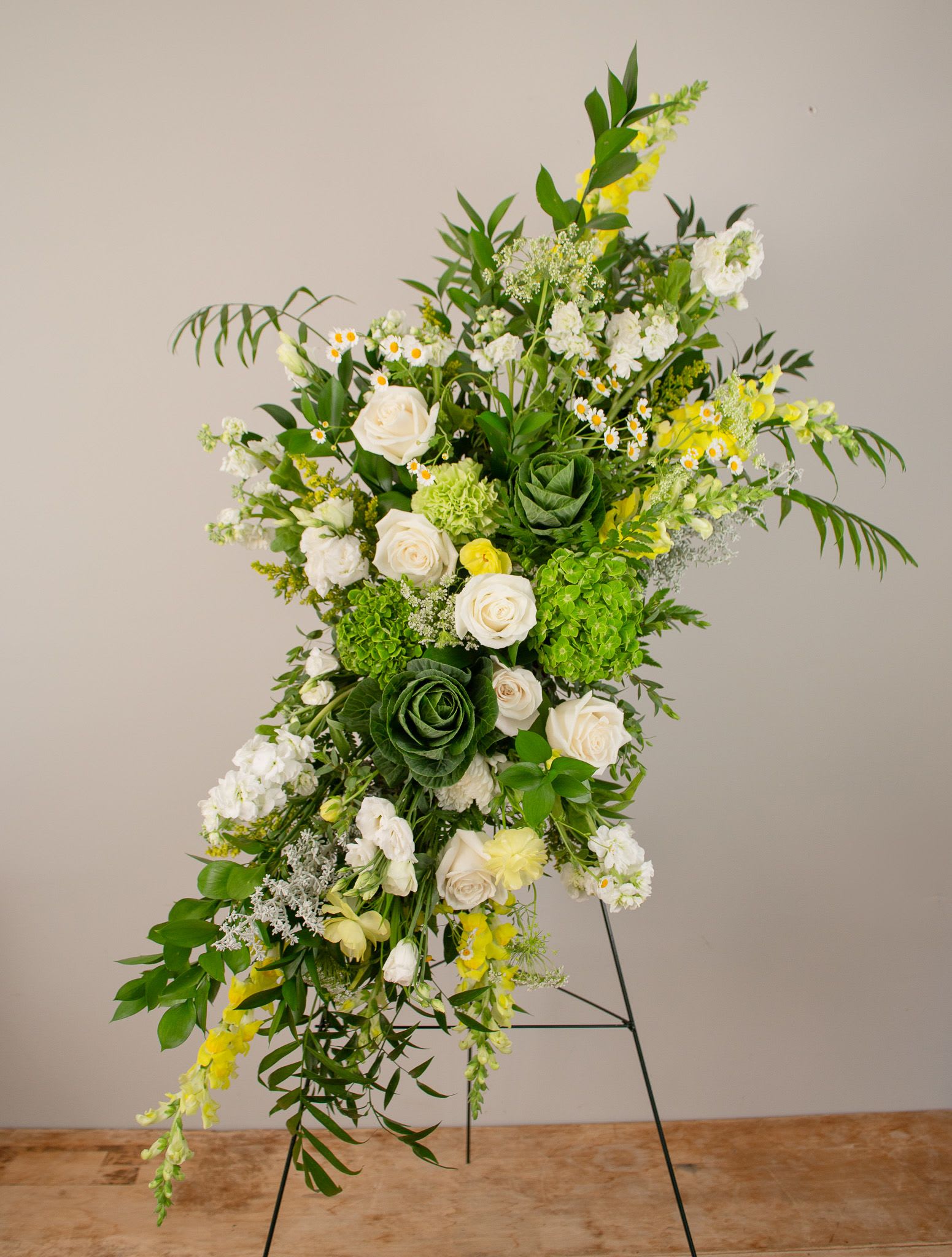 Grand Sympathy Spray - A sympathy spray generous in size, for a stunning remembrance piece.  More detailed and bigger than a traditional spray.  Alternate color palette available.     Sprays usually flank the casket but can also be used as a striking centerpiece or tribute.